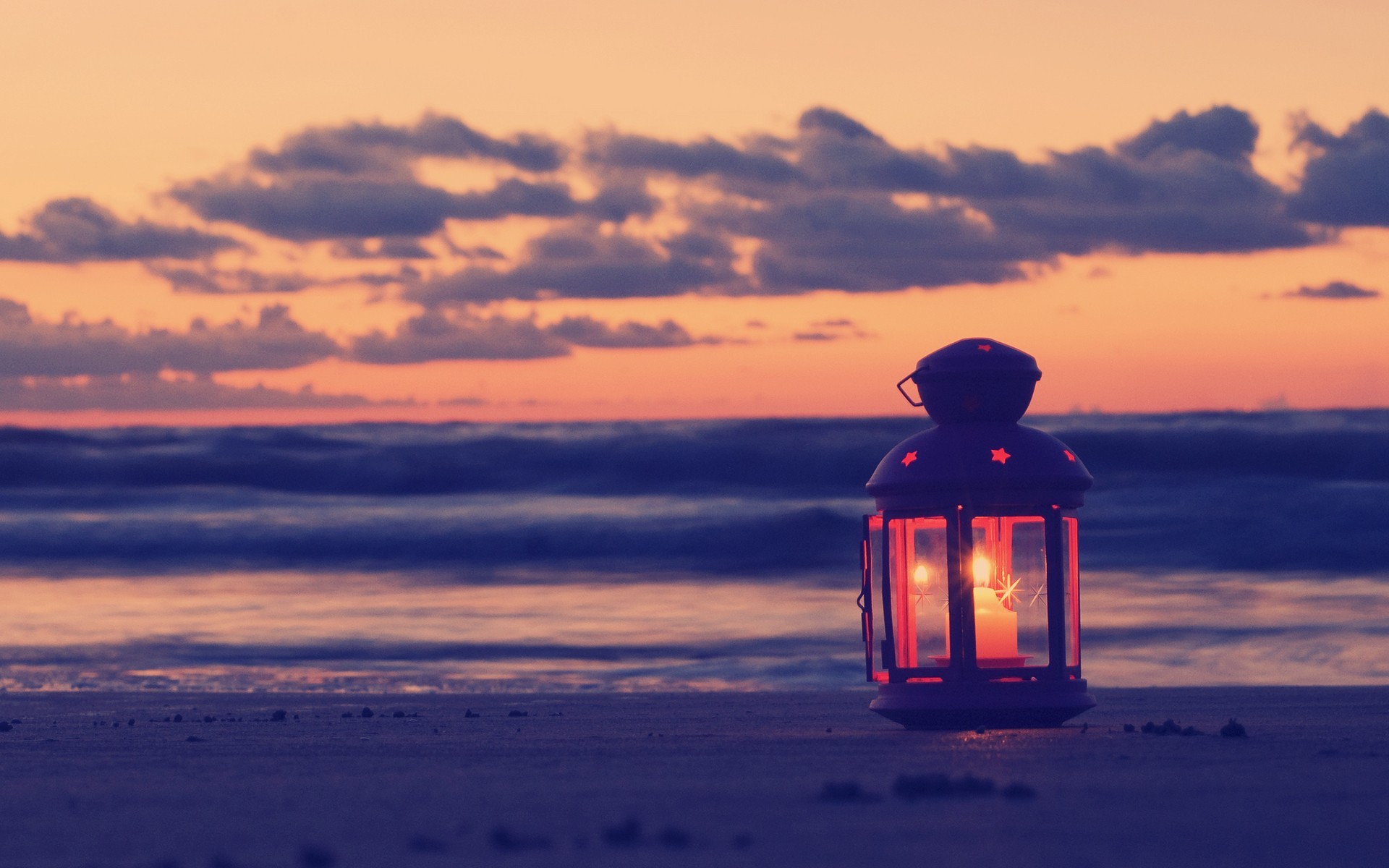 Lantern on a beach at sunset HD Wallpaper