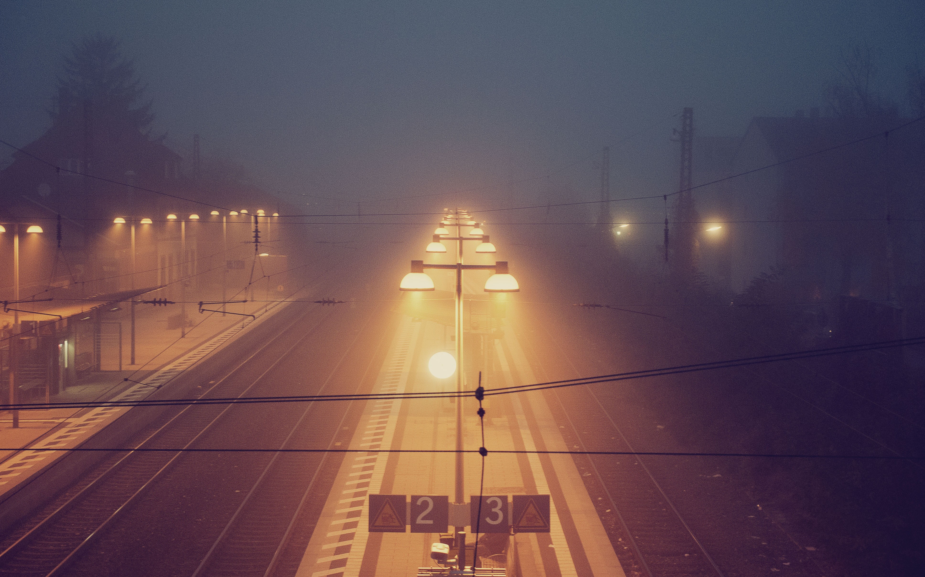 Train station at night with fog and lights HD Wallpaper