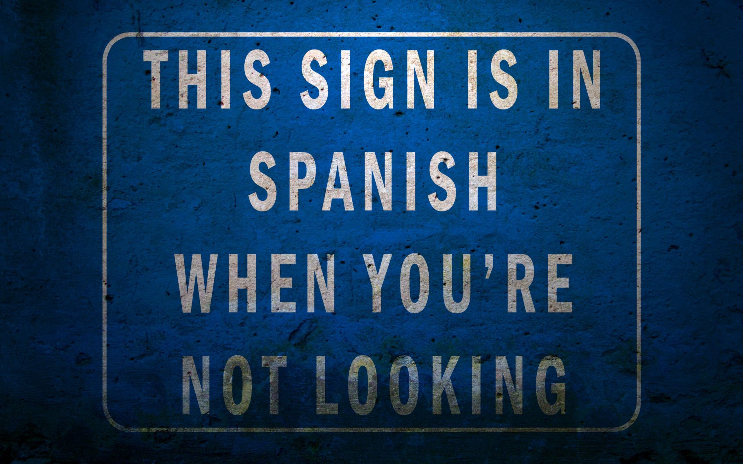 Sign says it's in Spanish when you're not looking HD Wallpaper