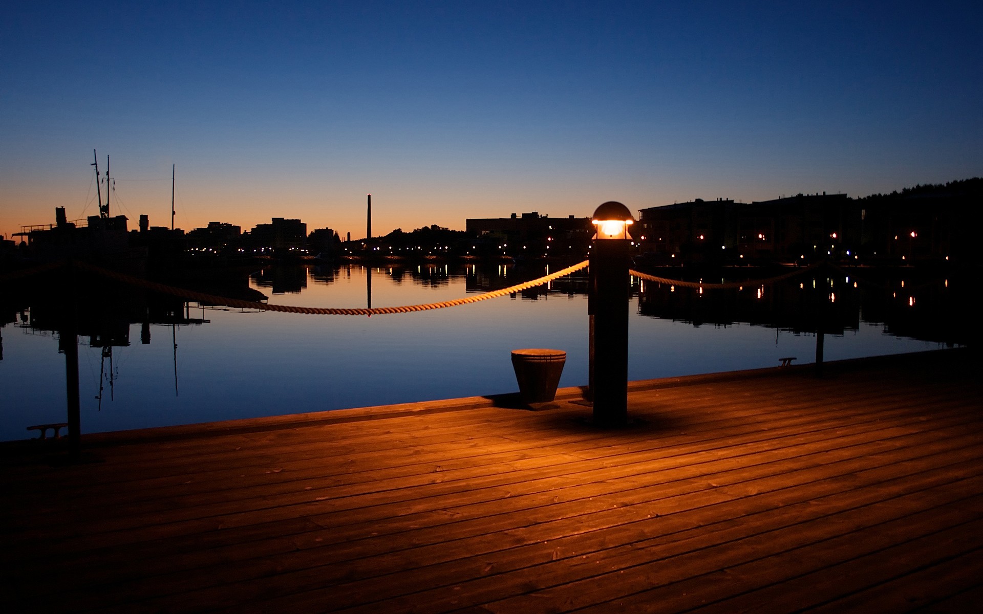 Harbor at sunset with wooden pier and lights HD Wallpaper