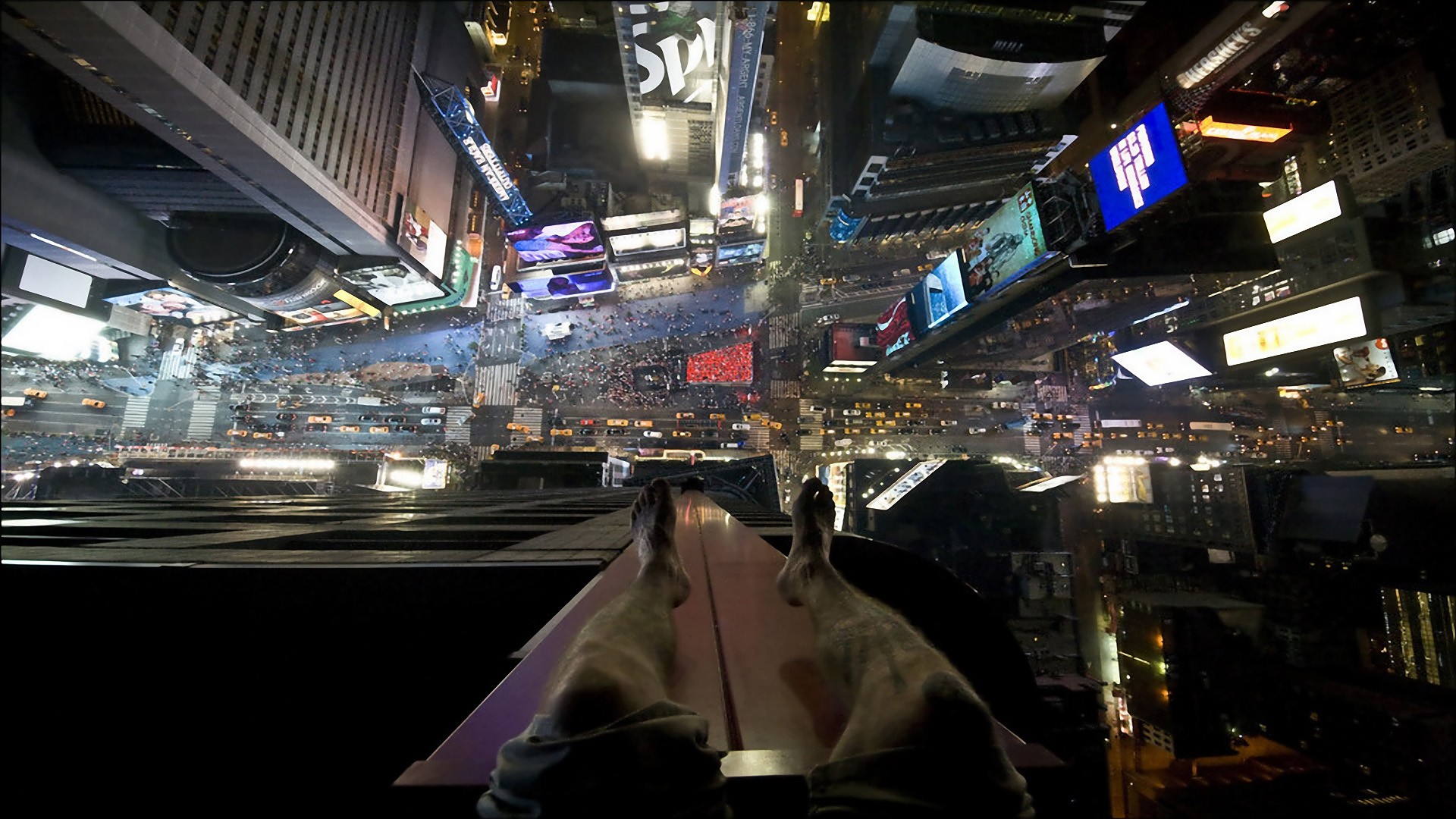 View from a skyscraper overlooking Times Square at night HD Wallpaper
