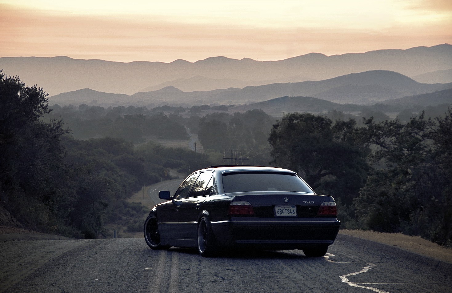 BMW 740 on a Mountain Road at Sunset HD Wallpaper