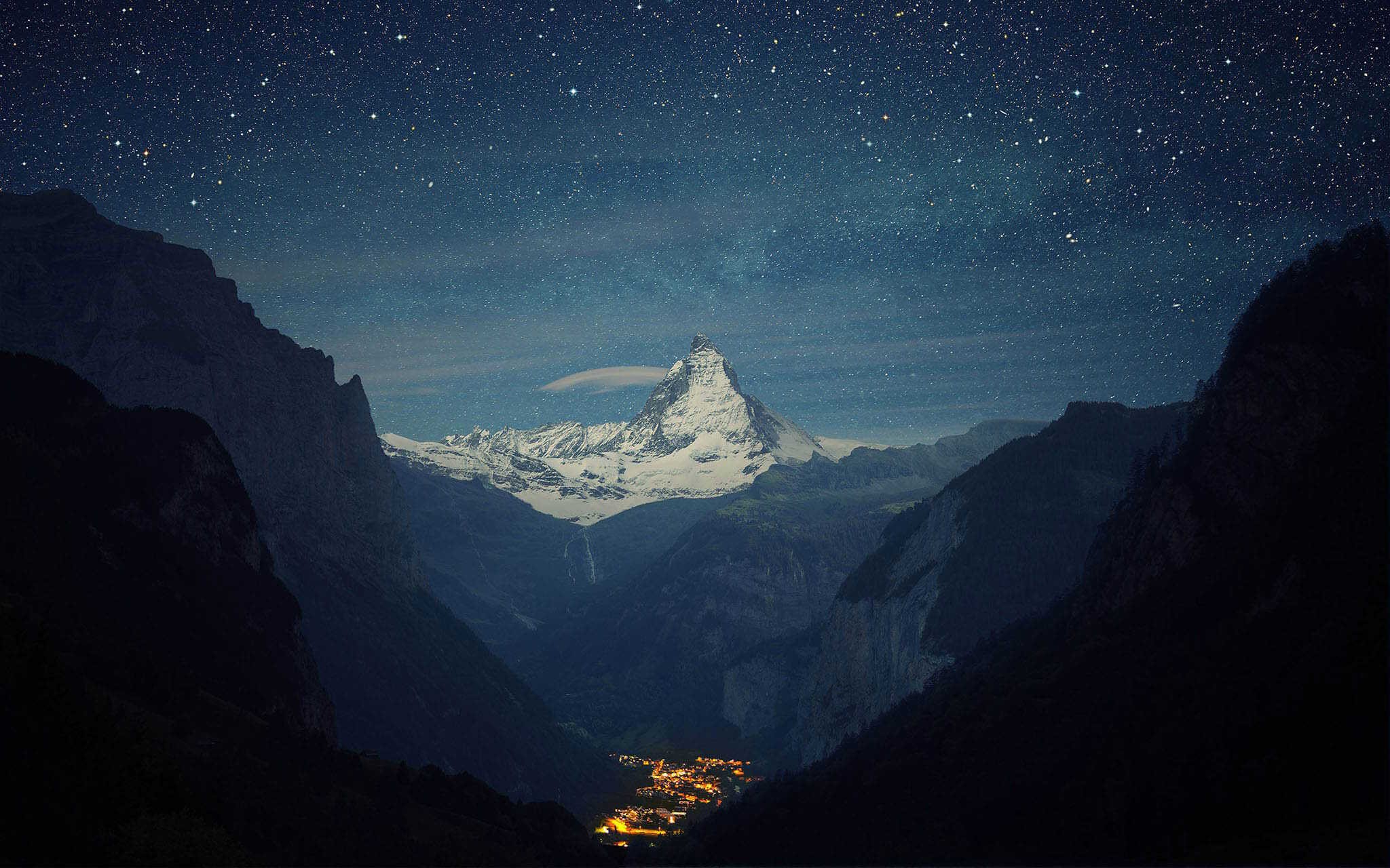 Matterhorn mountain under a starry night sky HD Wallpaper