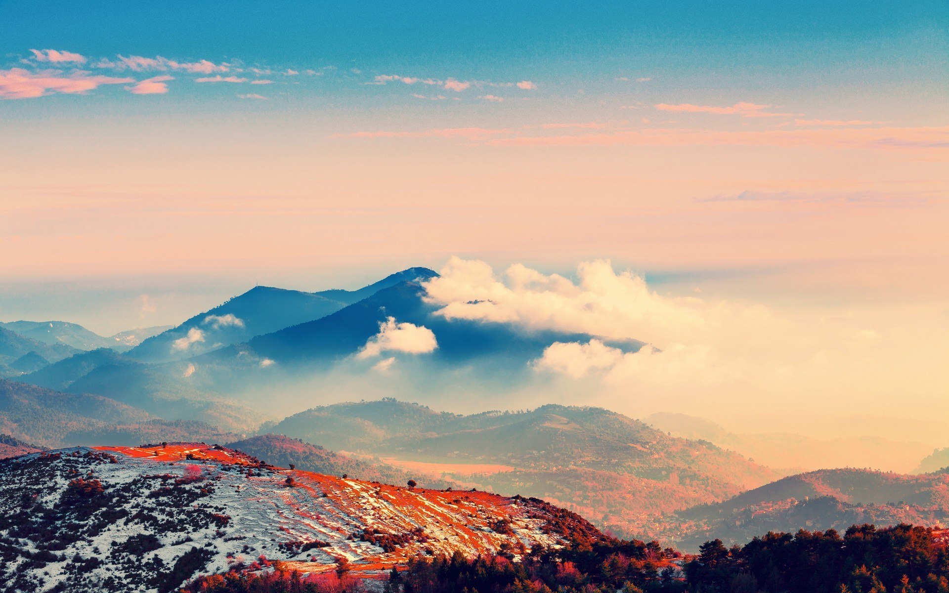 Misty mountains with snow and orange trees at sunset HD Wallpaper