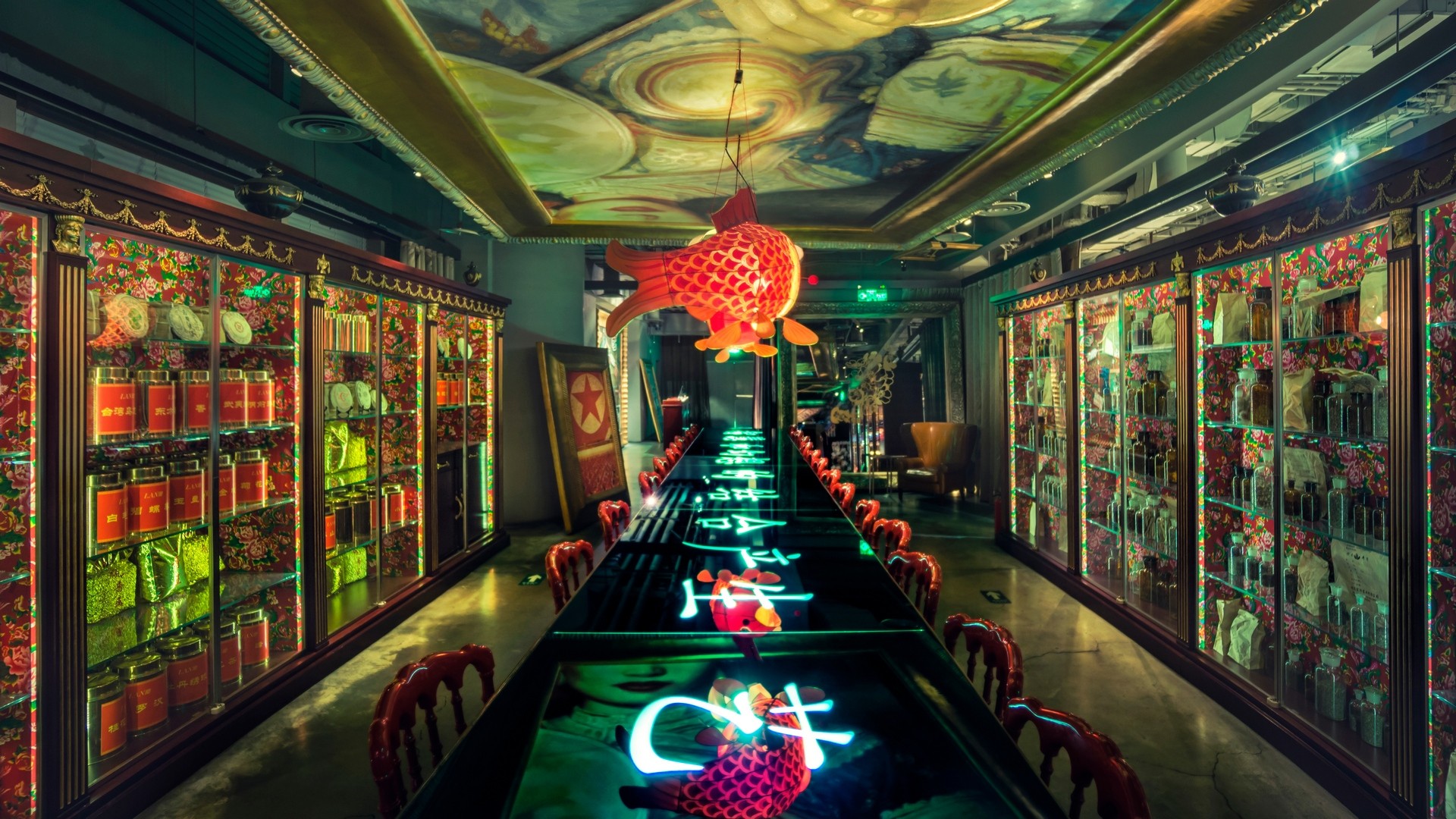 Long table with glowing Chinese characters and fish decorations HD Wallpaper