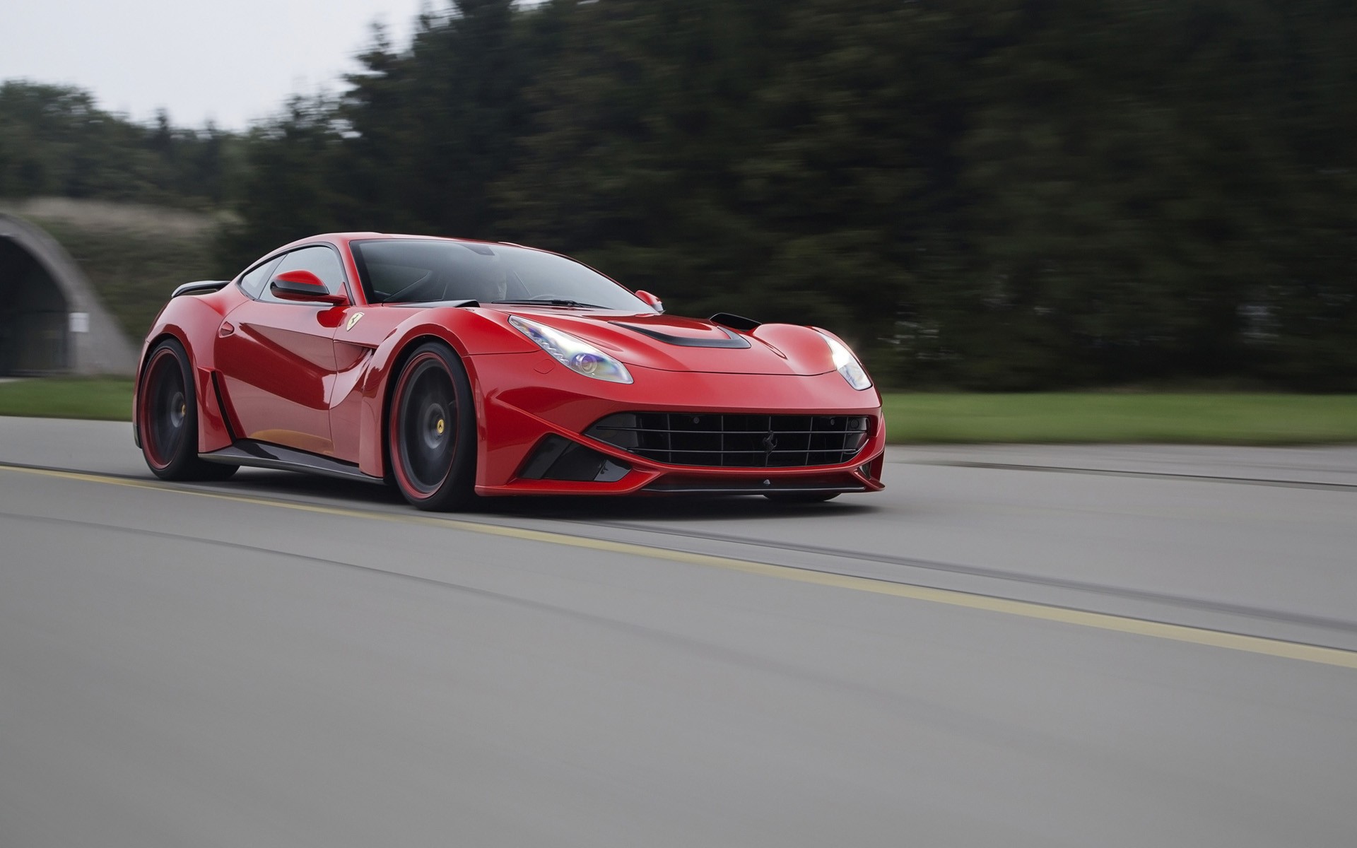 Red Novitec Ferrari F12tdf driving on a road HD Wallpaper