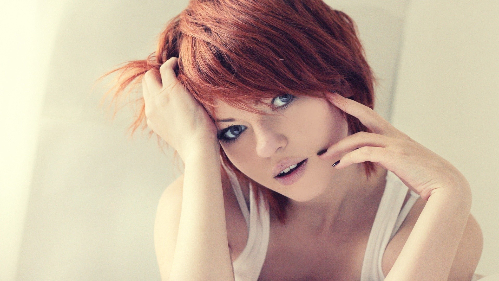 Redhead woman with hands in hair, painted nails HD Wallpaper