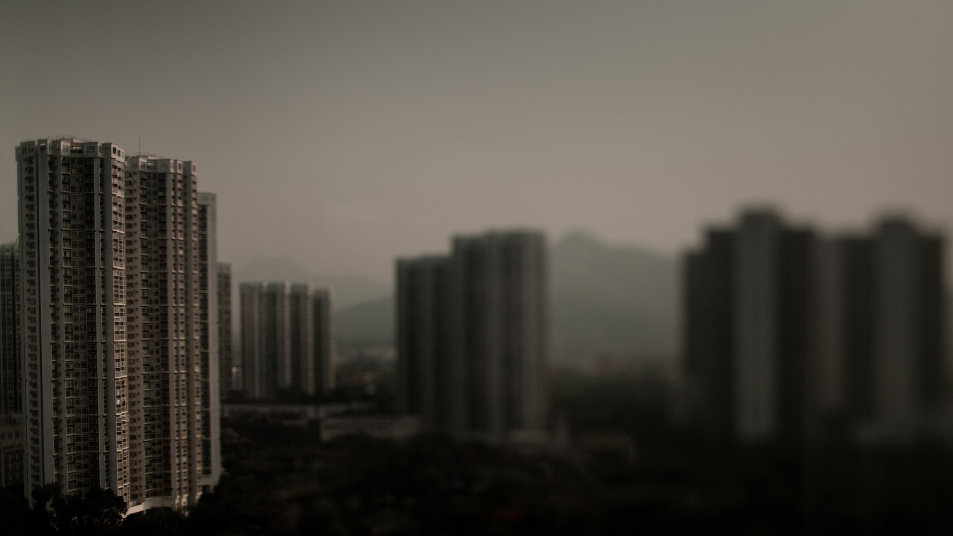Blurred cityscape with tall apartment buildings HD Wallpaper
