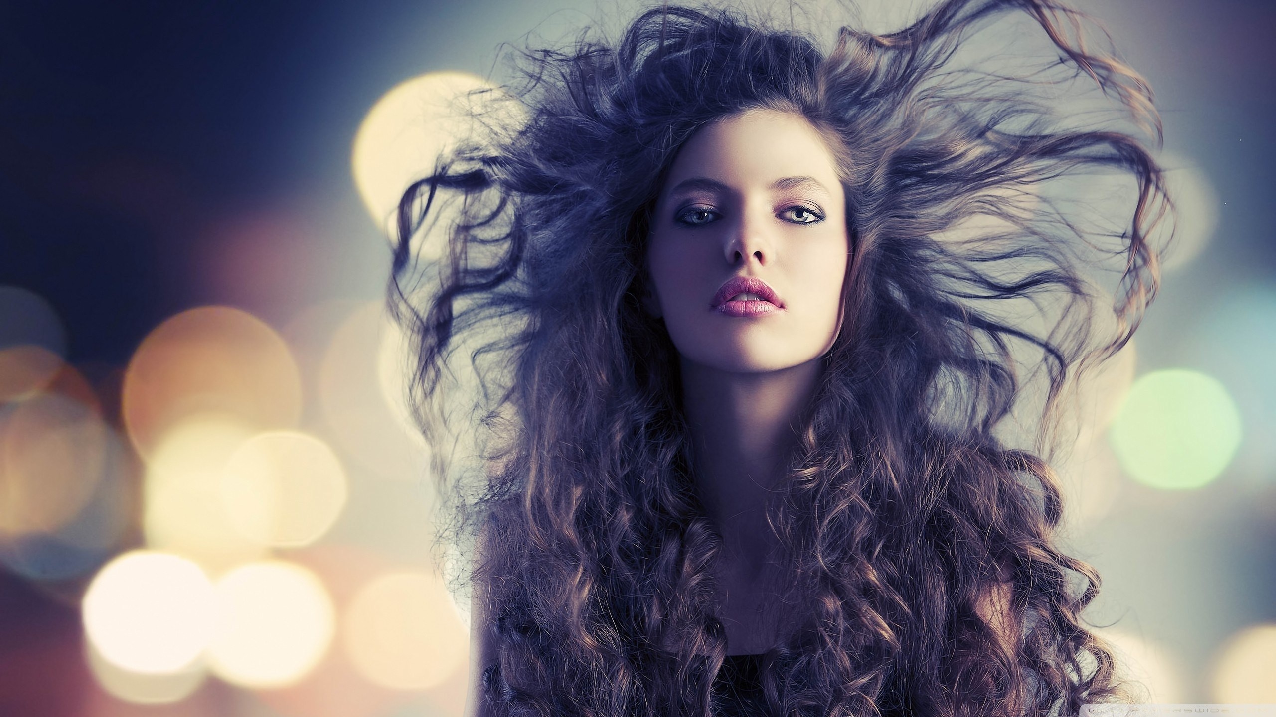 Woman with long curly hair and blue eyes HD Wallpaper