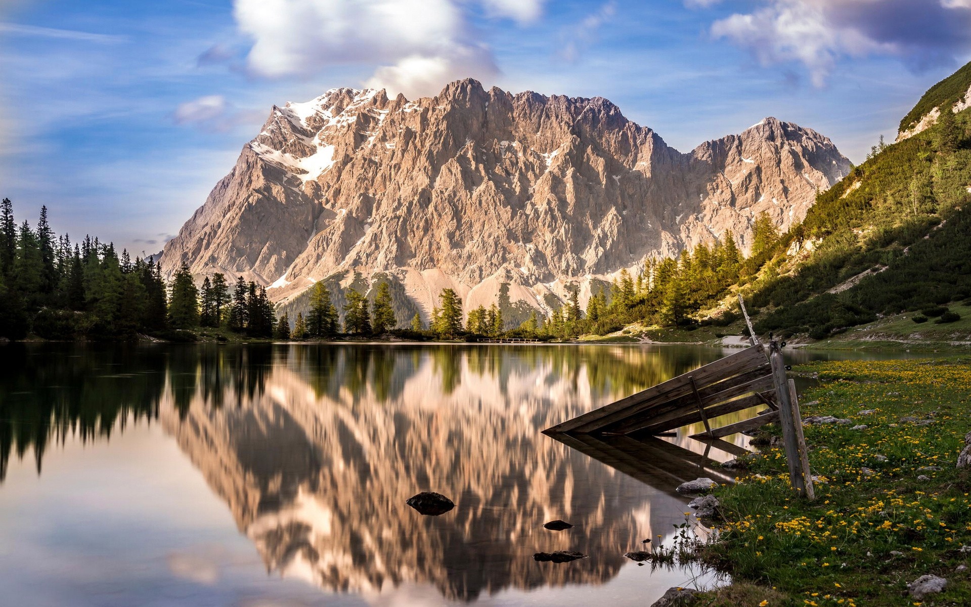 Mountain lake reflection with trees and wooden fence HD Wallpaper