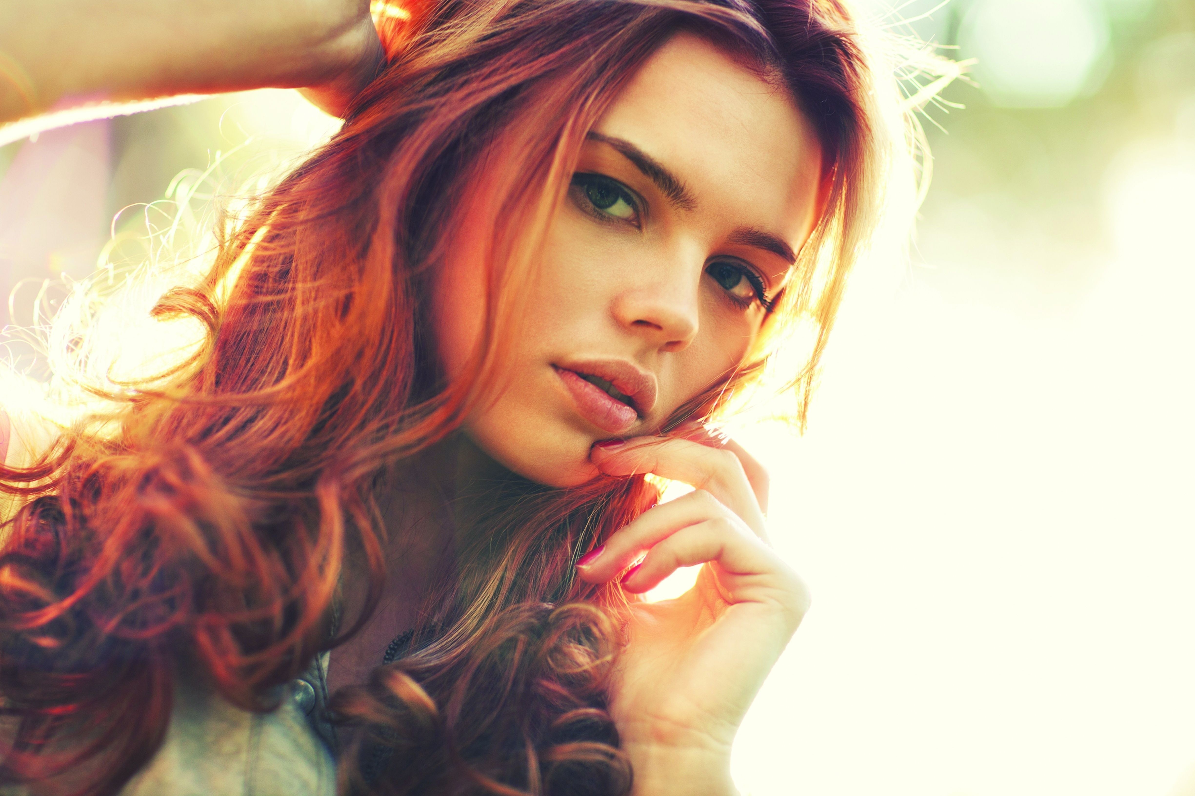 Woman with red hair touching her face HD Wallpaper