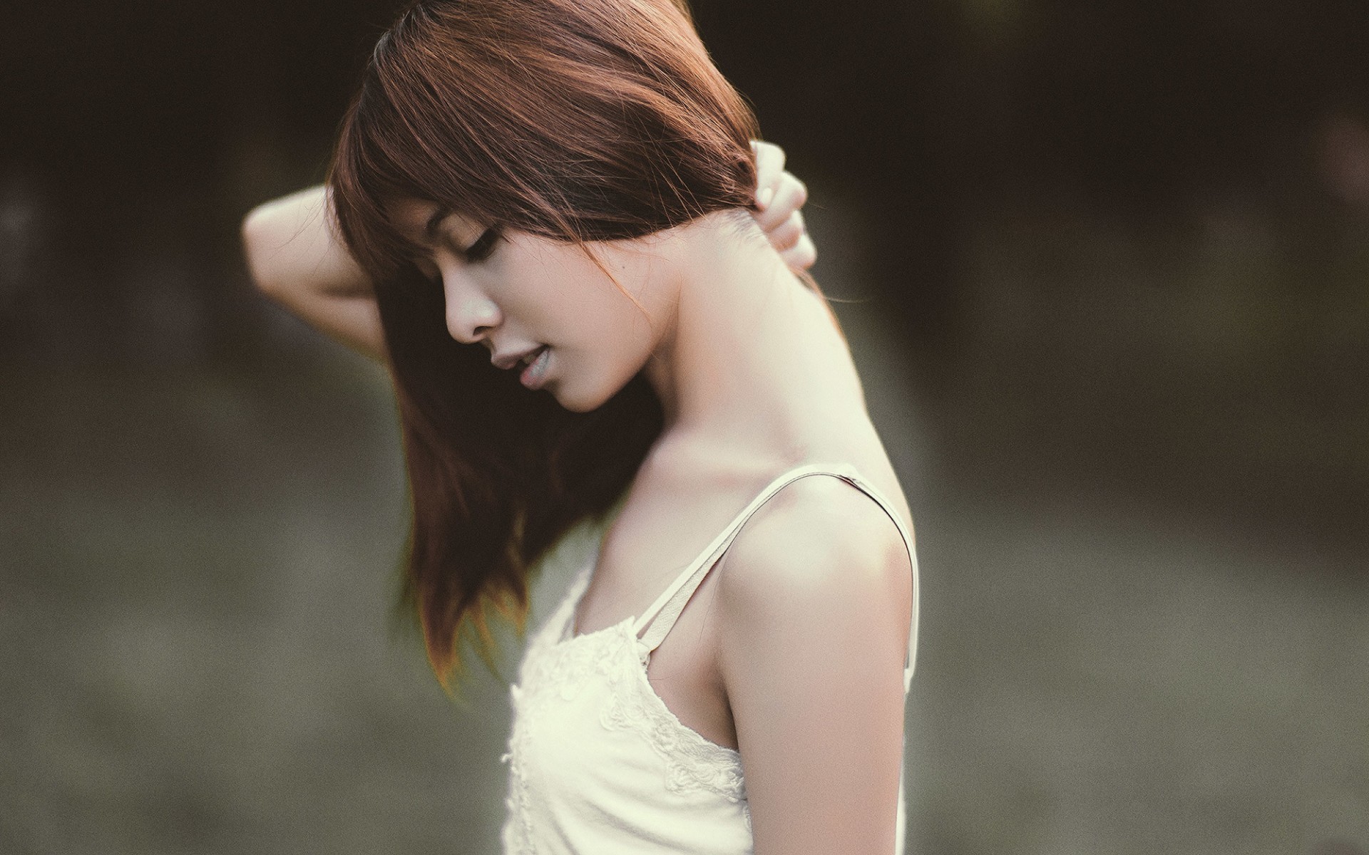 Asian woman with hand on neck HD Wallpaper