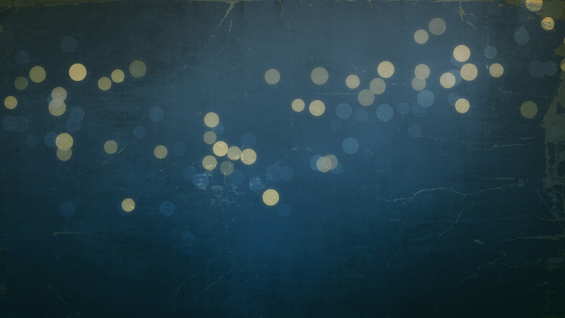 Abstract bokeh lights on a textured dark blue background HD Wallpaper
