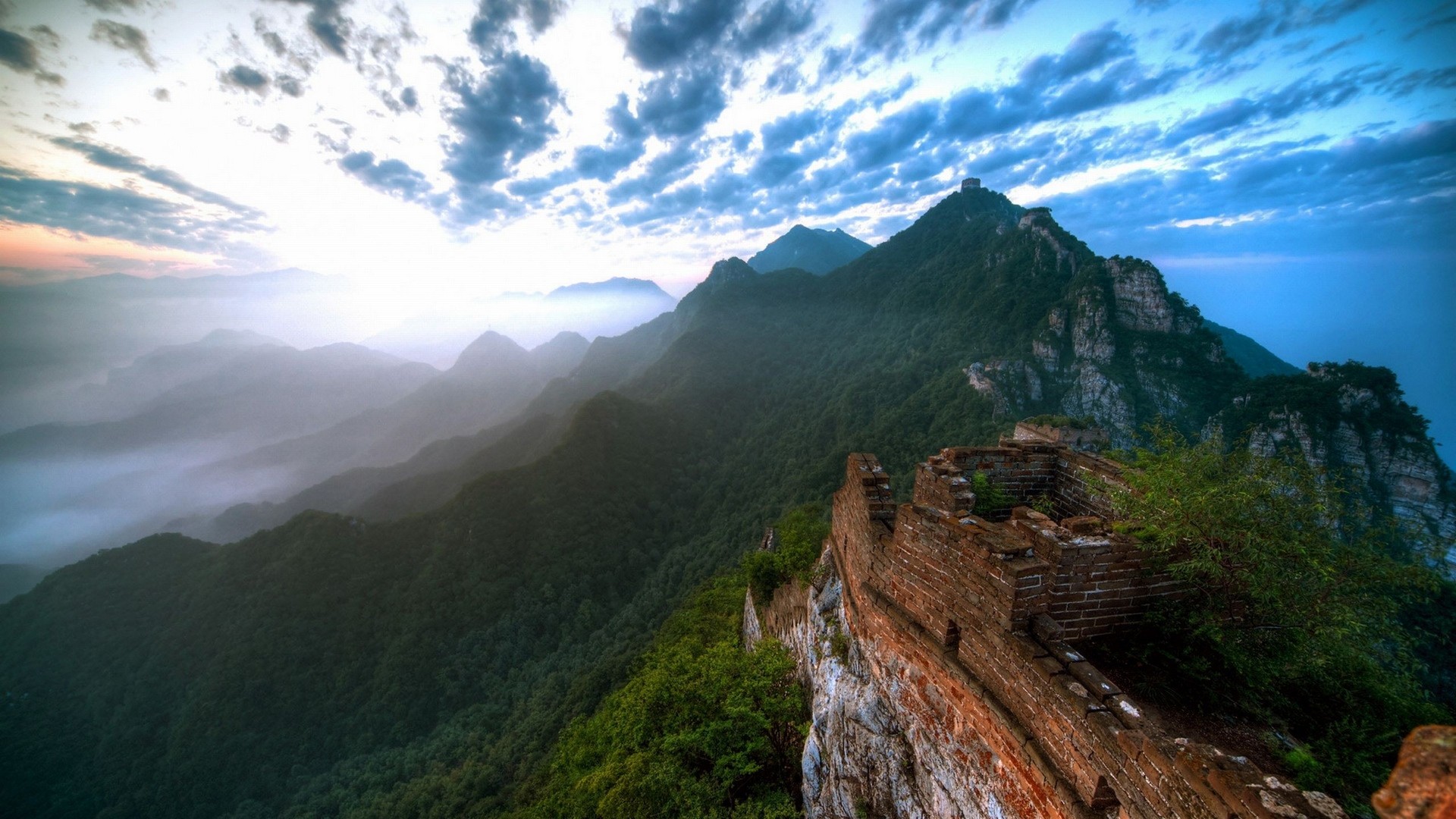 The Great Wall of China on a misty mountain range HD Wallpaper