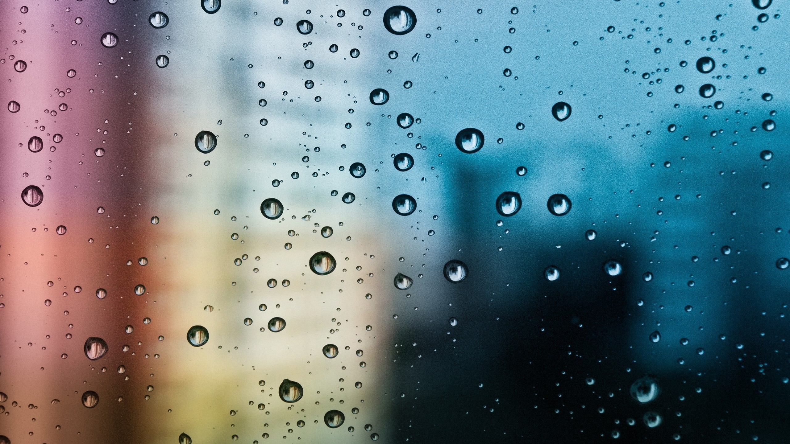 Water drops on glass with colorful background HD Wallpaper