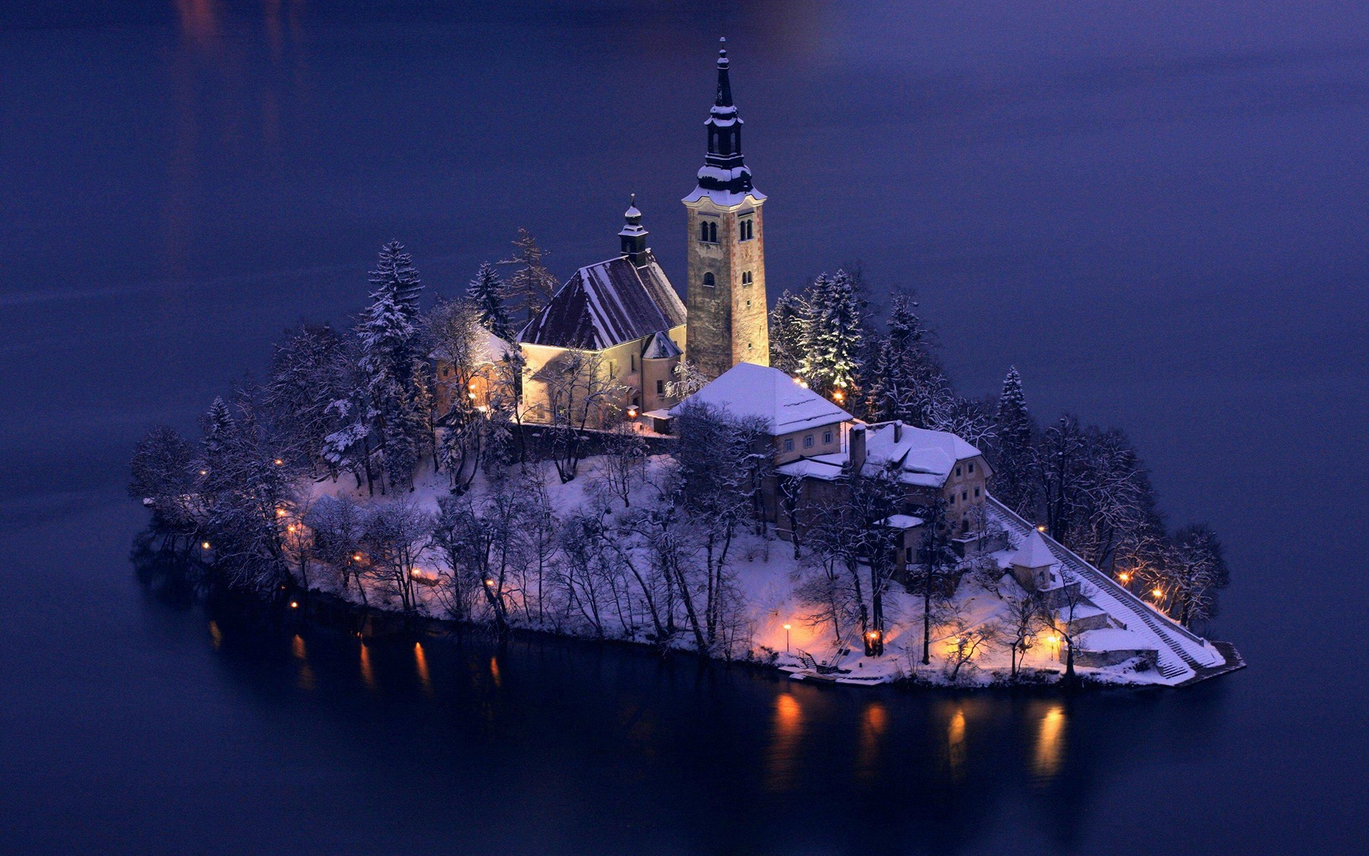Church on an island in Slovenia during winter HD Wallpaper