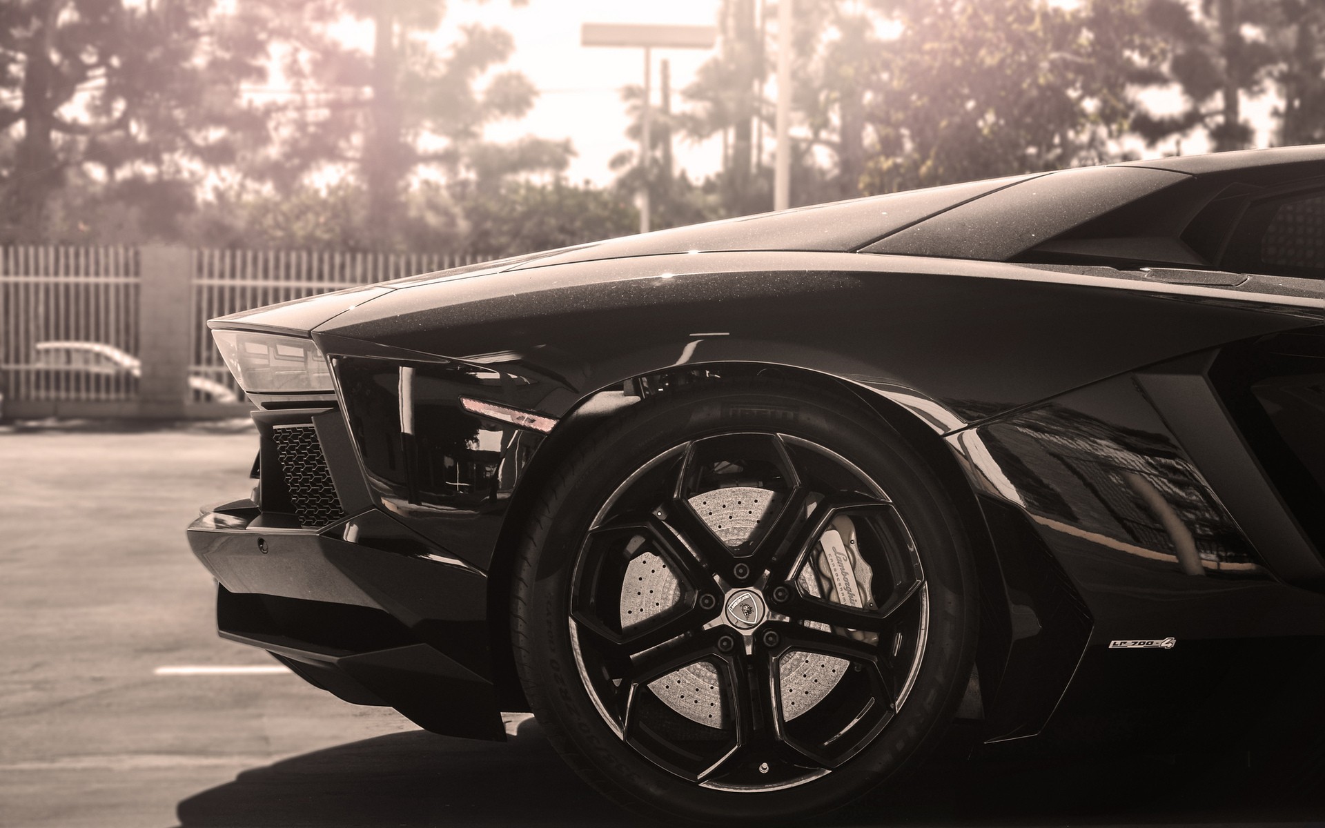 Black Lamborghini Aventador parked outdoors HD Wallpaper