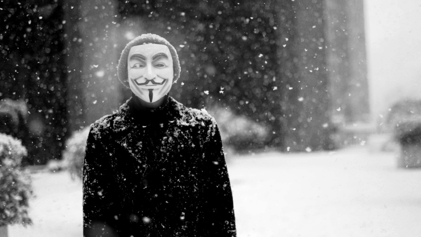 Anonymous Guy Fawkes mask in snow HD Wallpaper