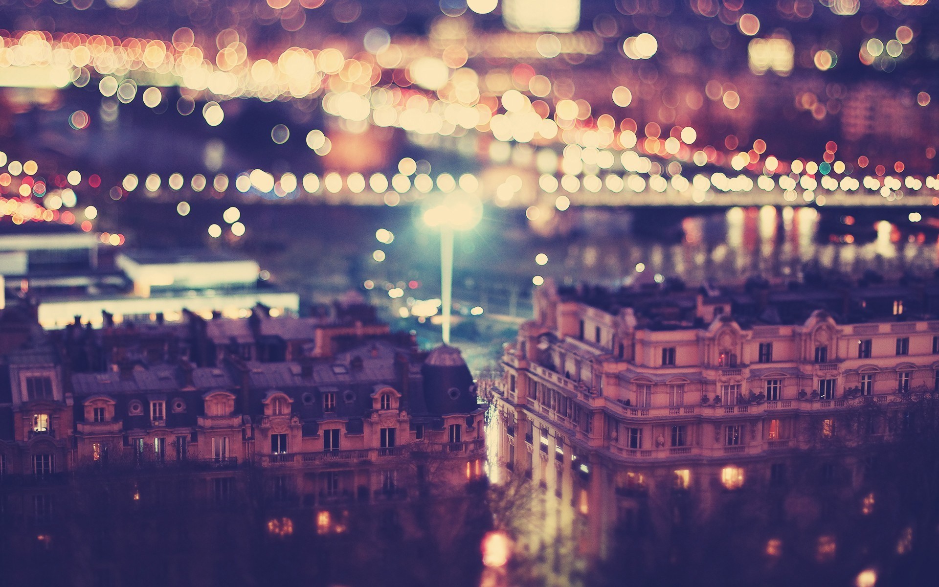 Cityscape at night with bokeh lights HD Wallpaper