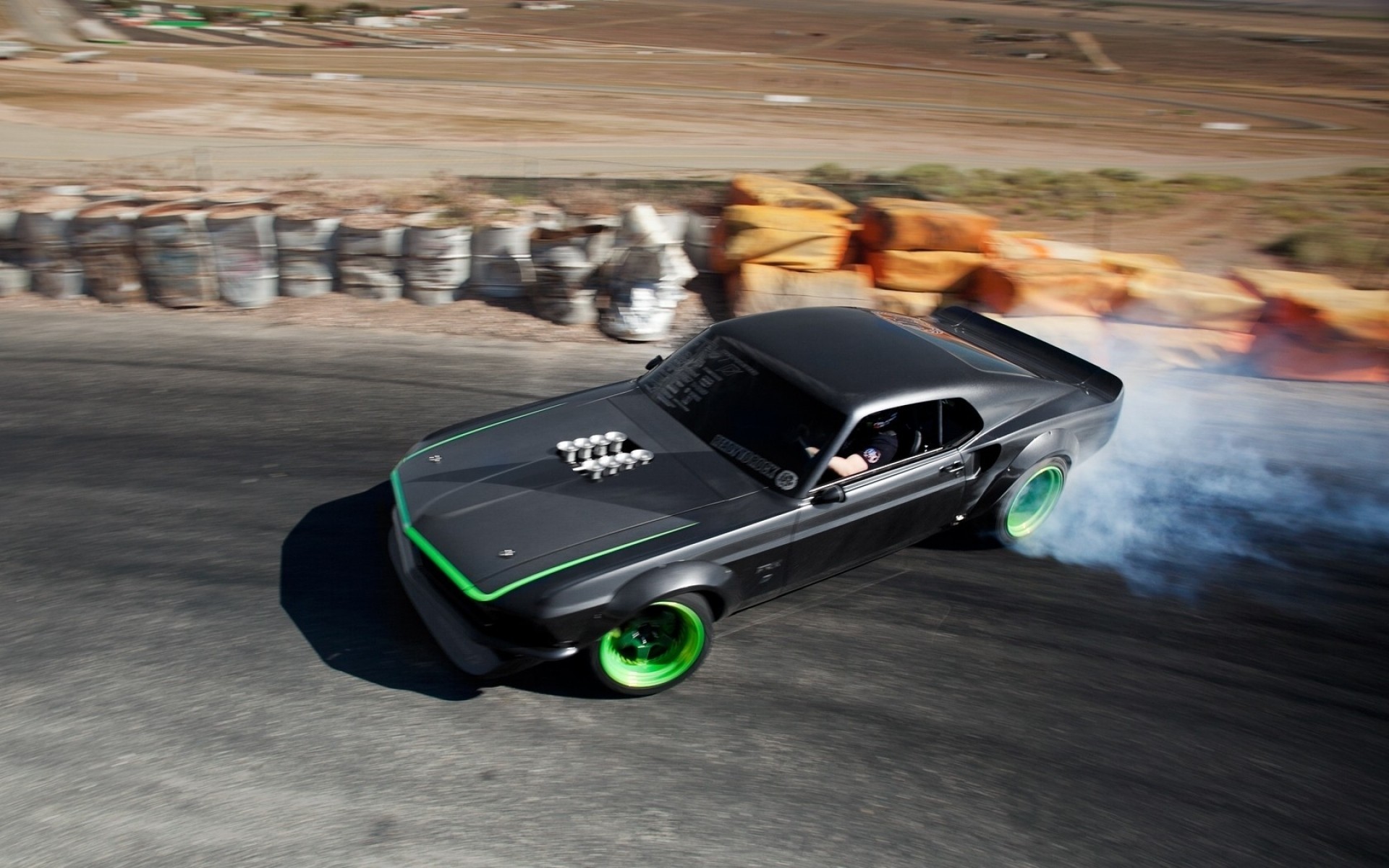 Ford Mustang drifting on a race track HD Wallpaper