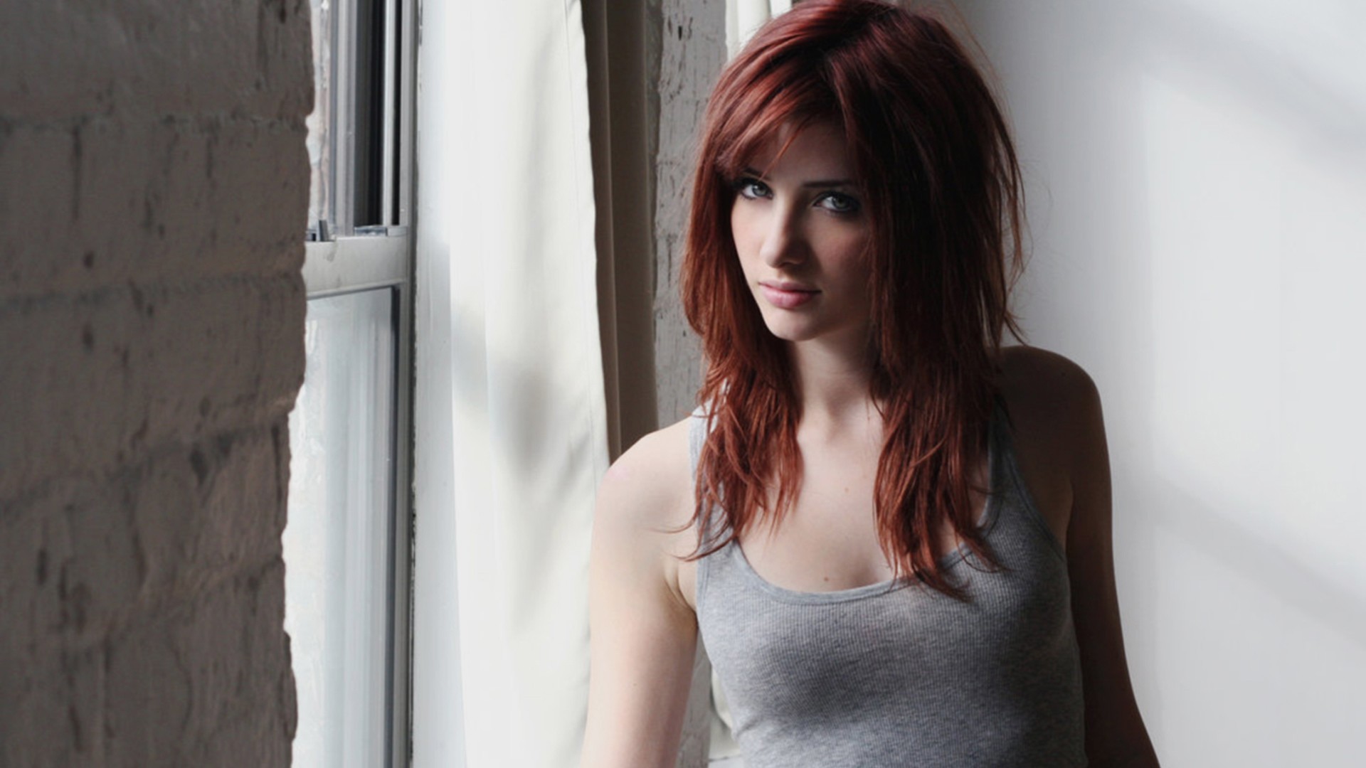 Susan Coffey with red hair by the window HD Wallpaper