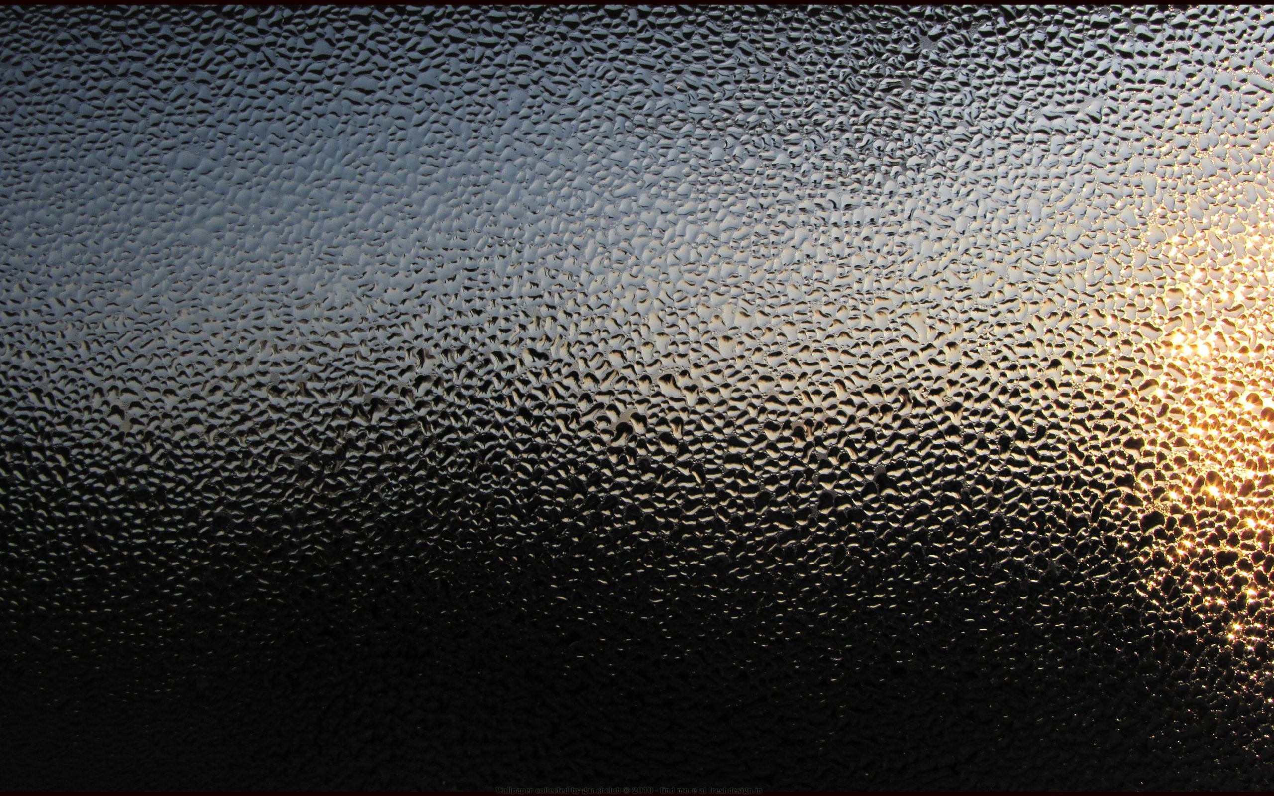 Water drops on textured glass with sunlight HD Wallpaper