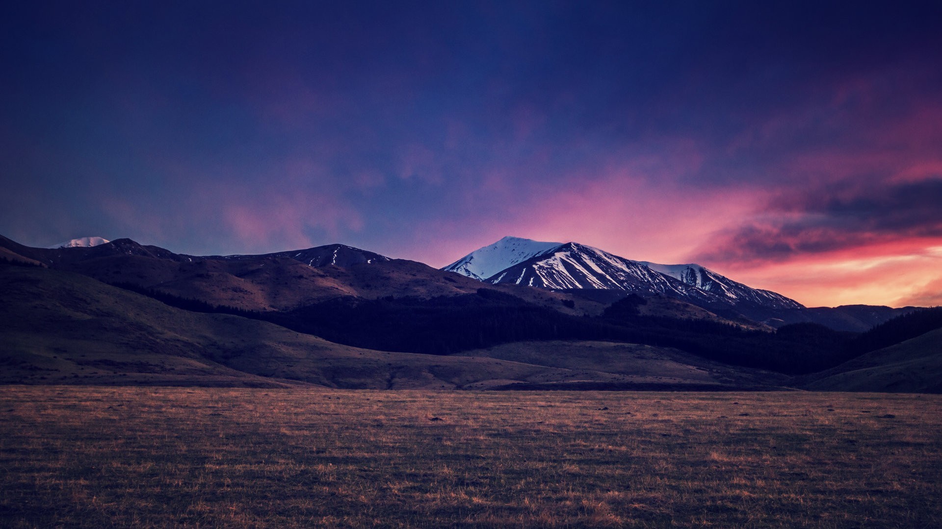 Mountains under a colorful twilight sky HD Wallpaper