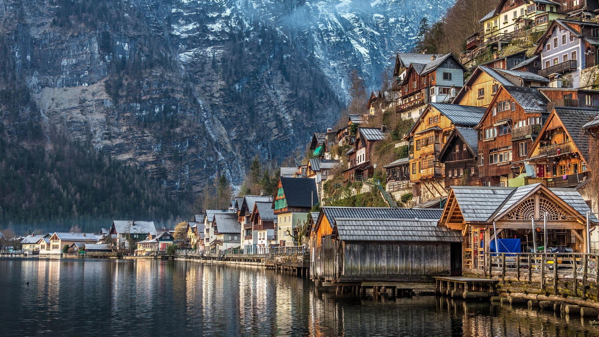 Hallstatt village on a mountainside by a lake HD Wallpaper