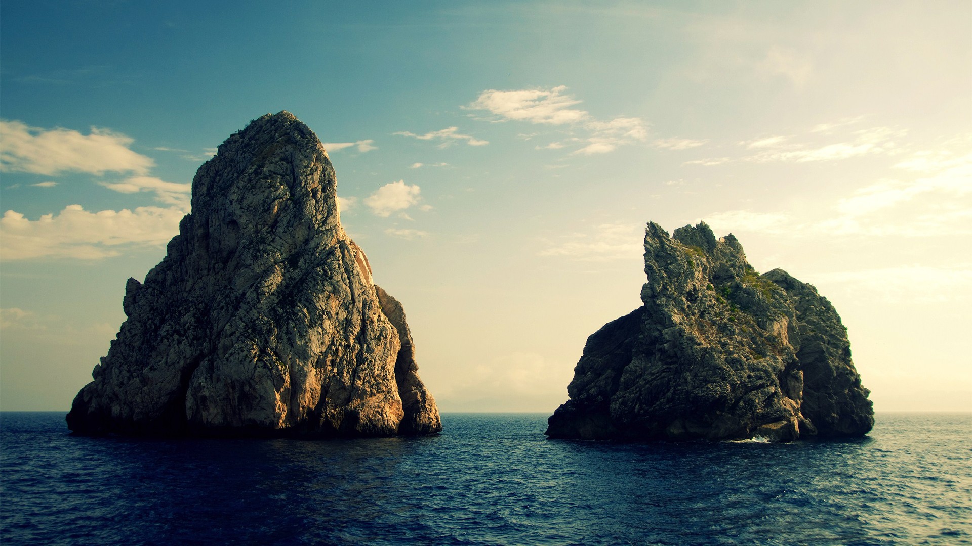 Two rocky islands in the sea HD Wallpaper