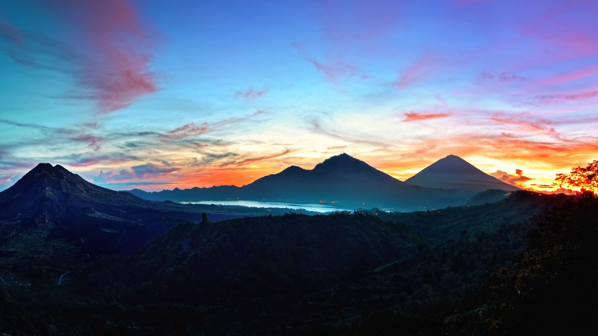 Volcanic mountains at sunrise with colorful sky HD Wallpaper