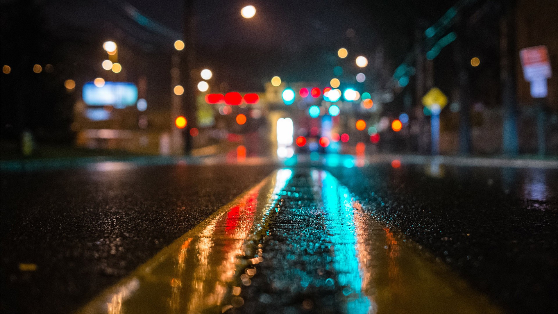 Wet street at night with bokeh lights HD Wallpaper