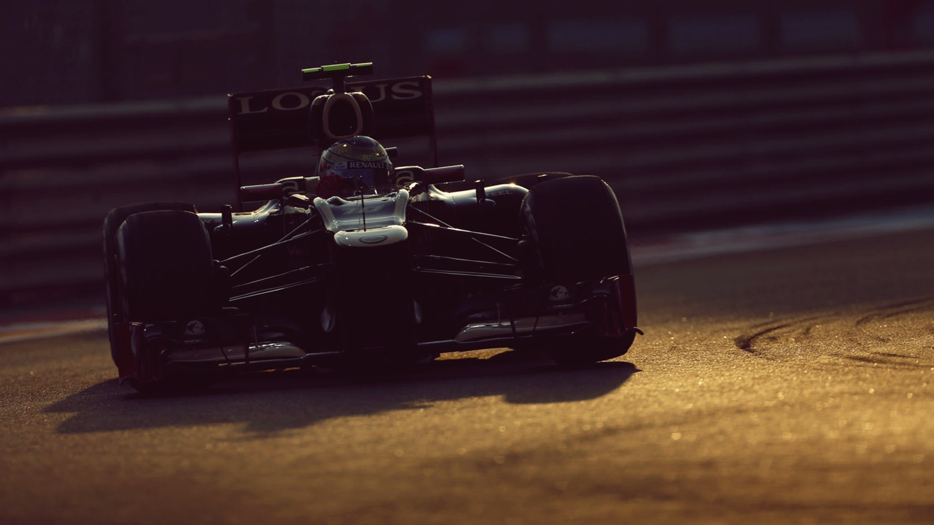 Lotus Formula 1 car on a race track HD Wallpaper