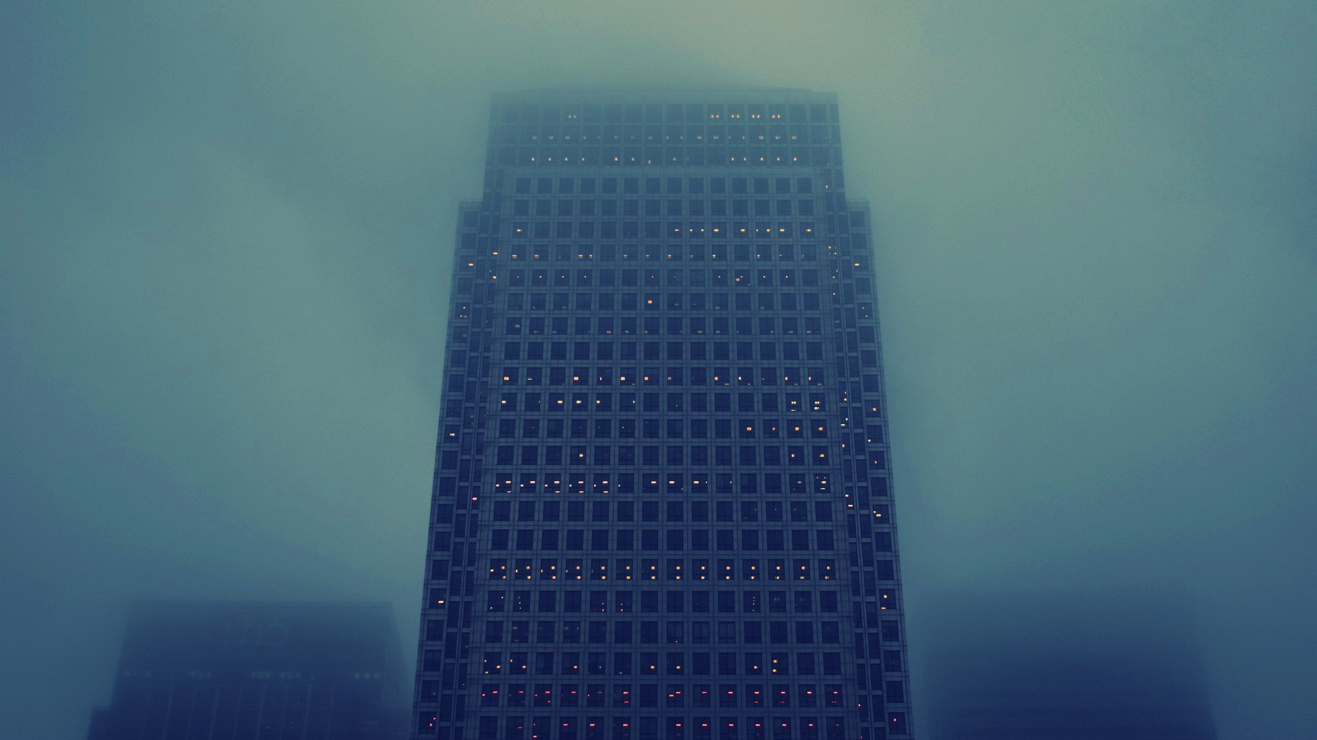Skyscraper shrouded in mist HD Wallpaper
