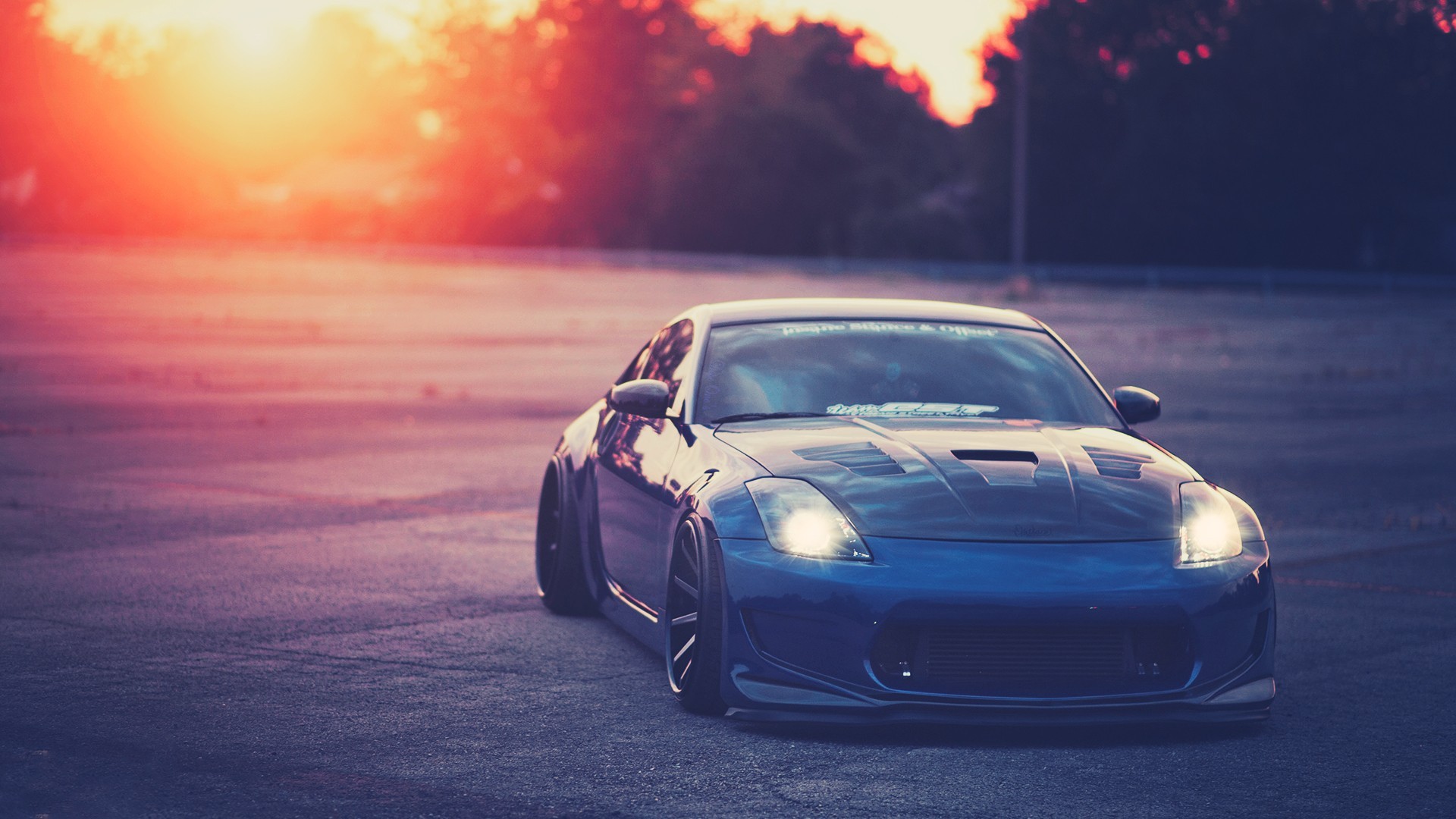 Blue Nissan 350Z sports car at sunset HD Wallpaper