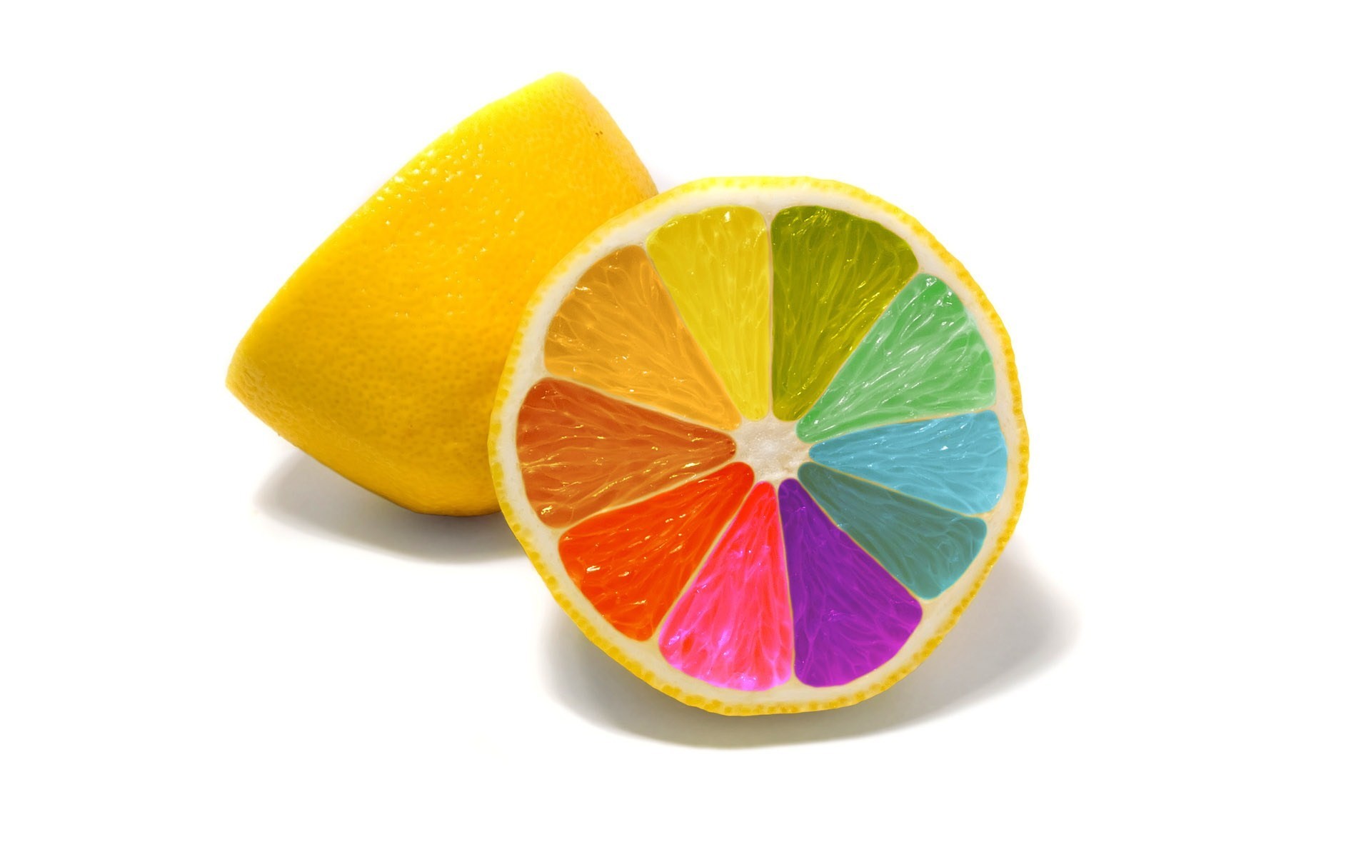 A colorful lemon slice and a whole lemon on a white background HD Wallpaper