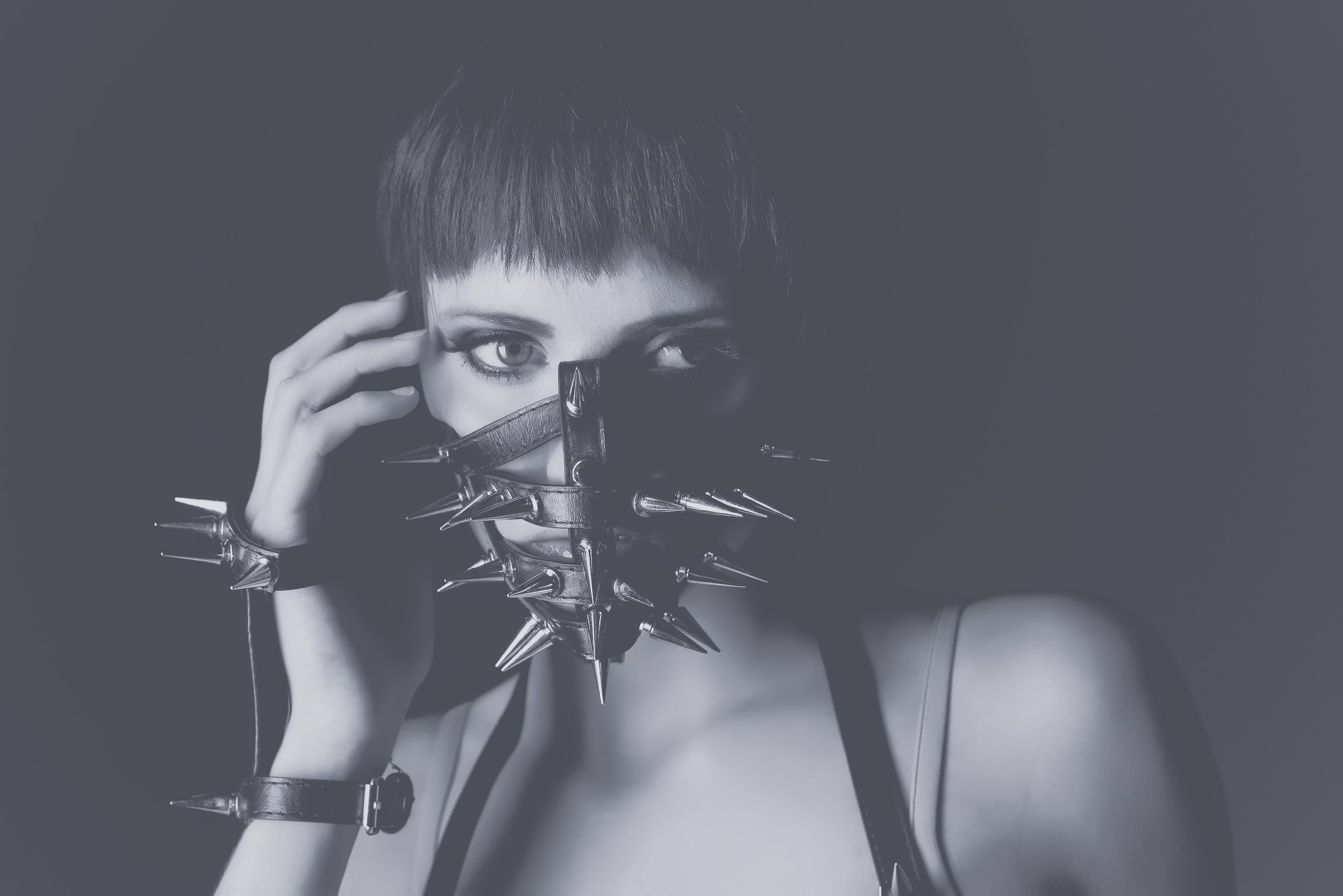 Woman wearing a spiked mask and wristbands HD Wallpaper