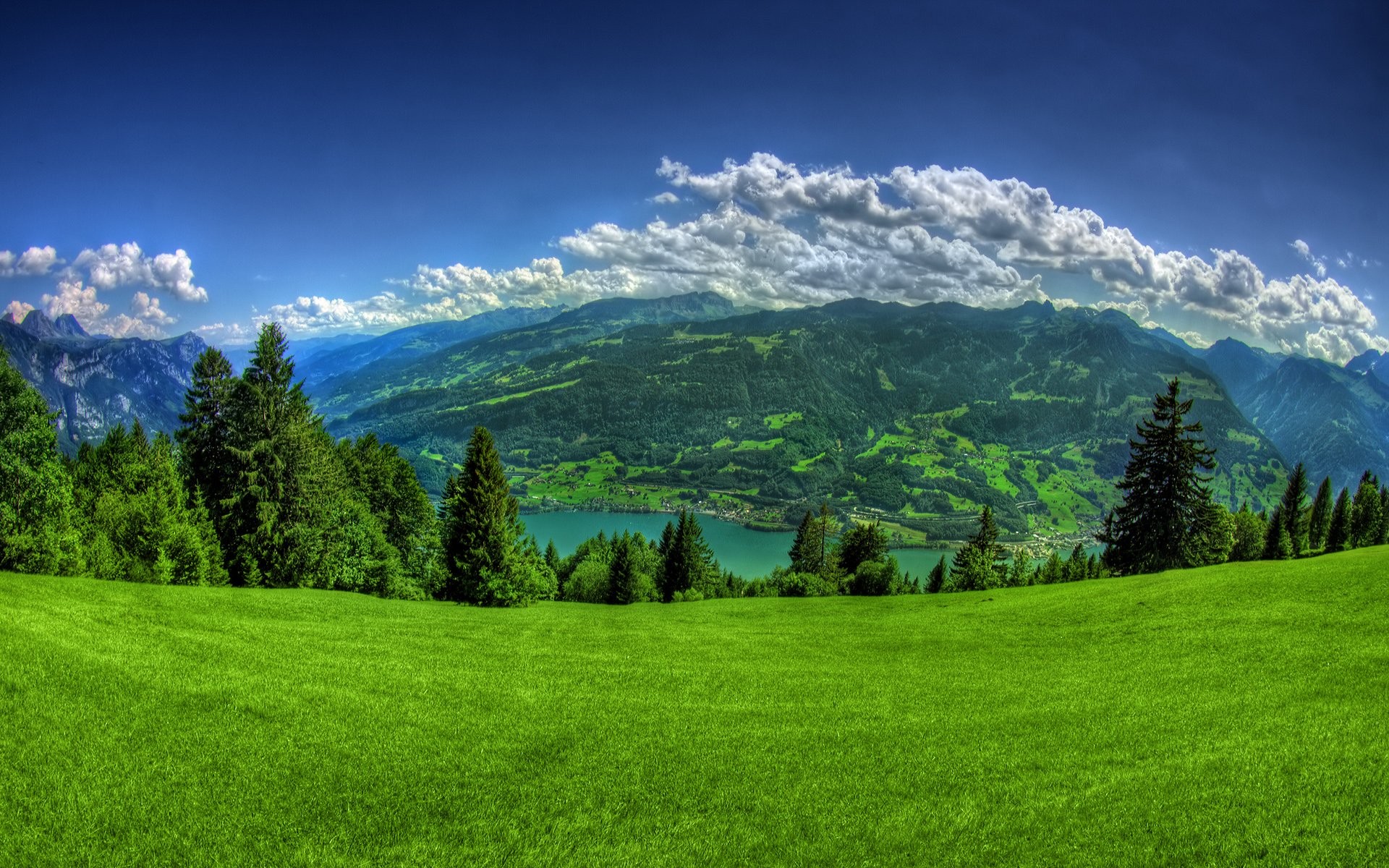 Panoramic view of mountains and a lake HD Wallpaper