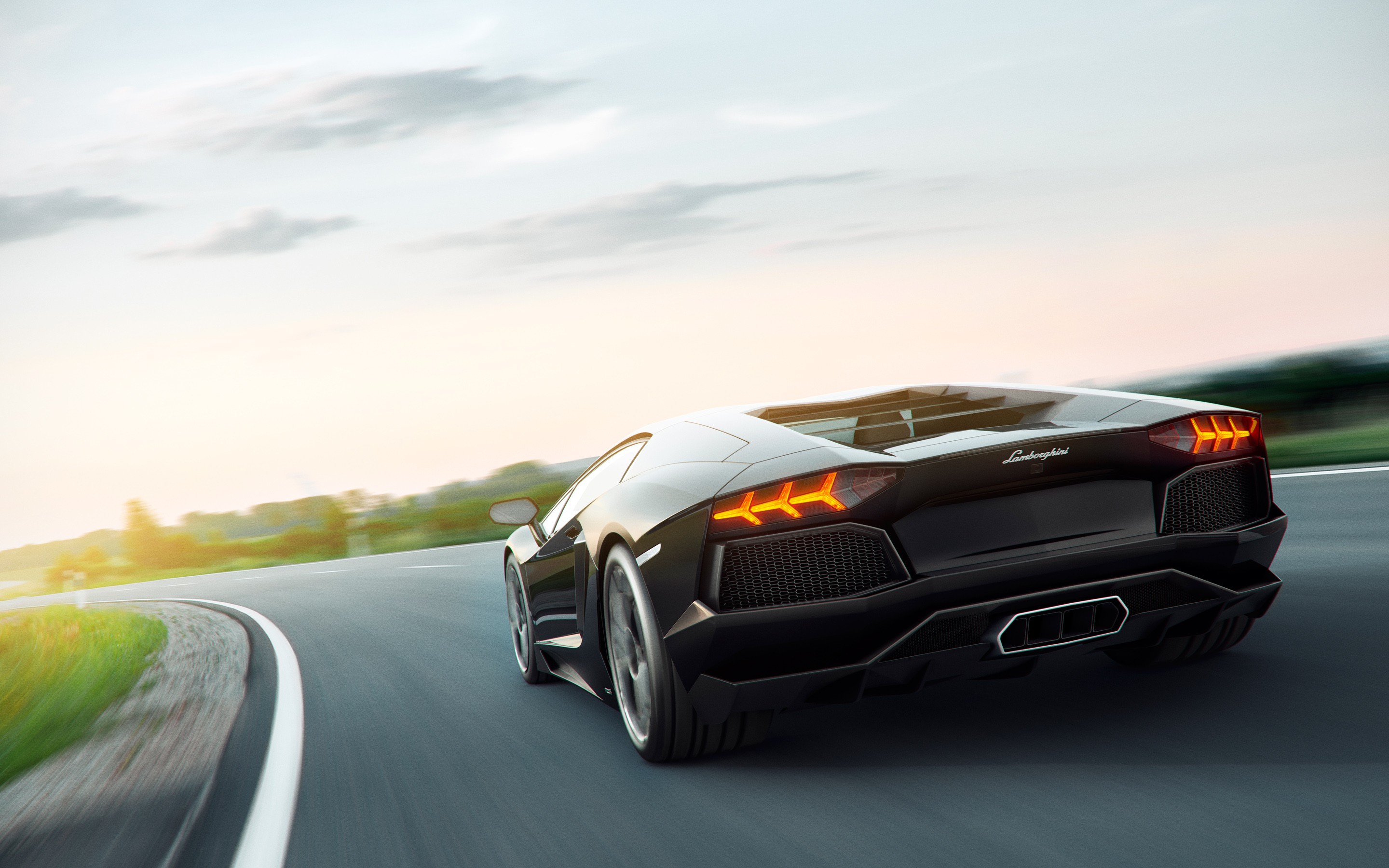 Black Lamborghini Aventador driving on a road HD Wallpaper
