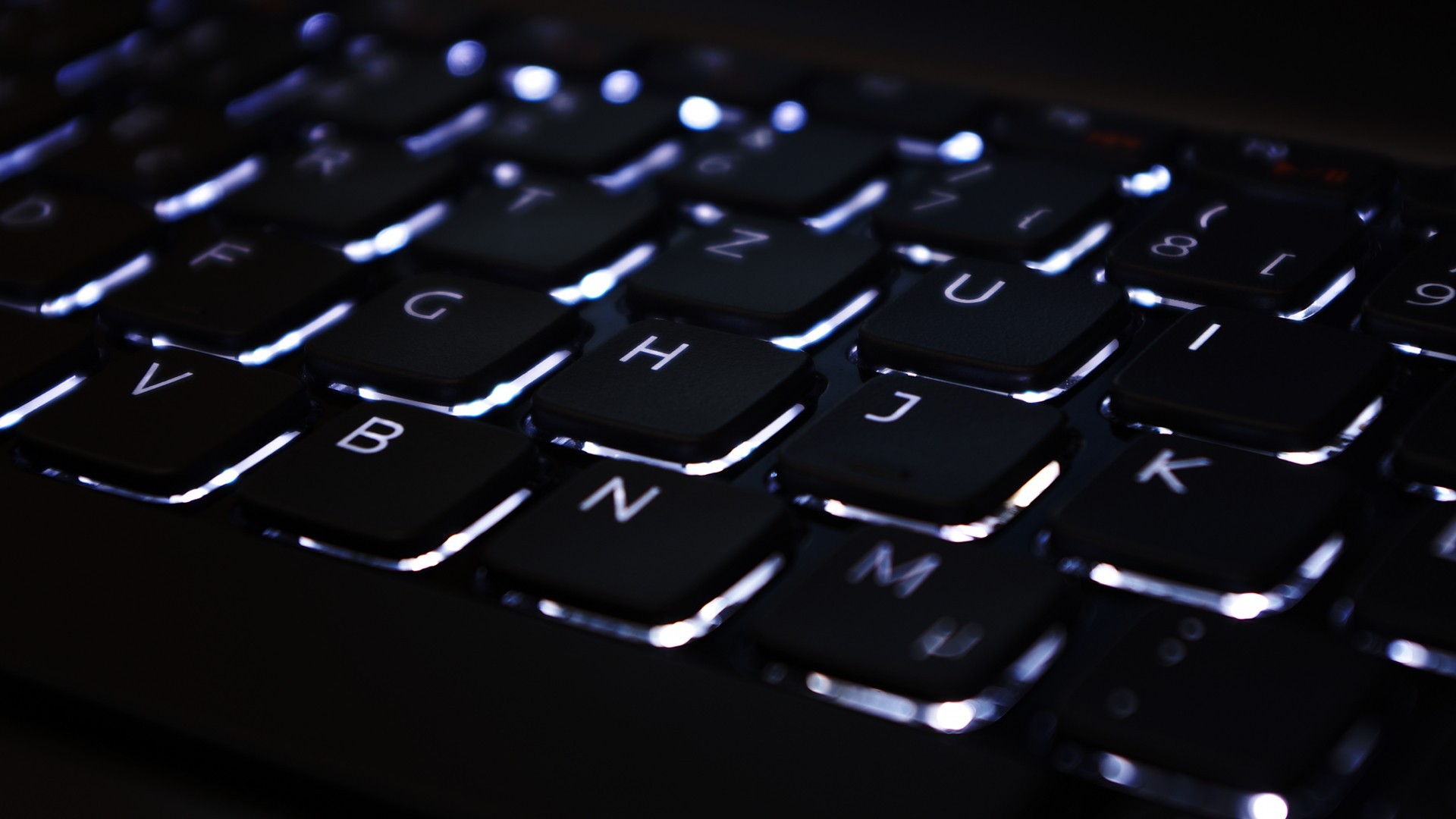 ASUS laptop keyboard with white backlighting HD Wallpaper