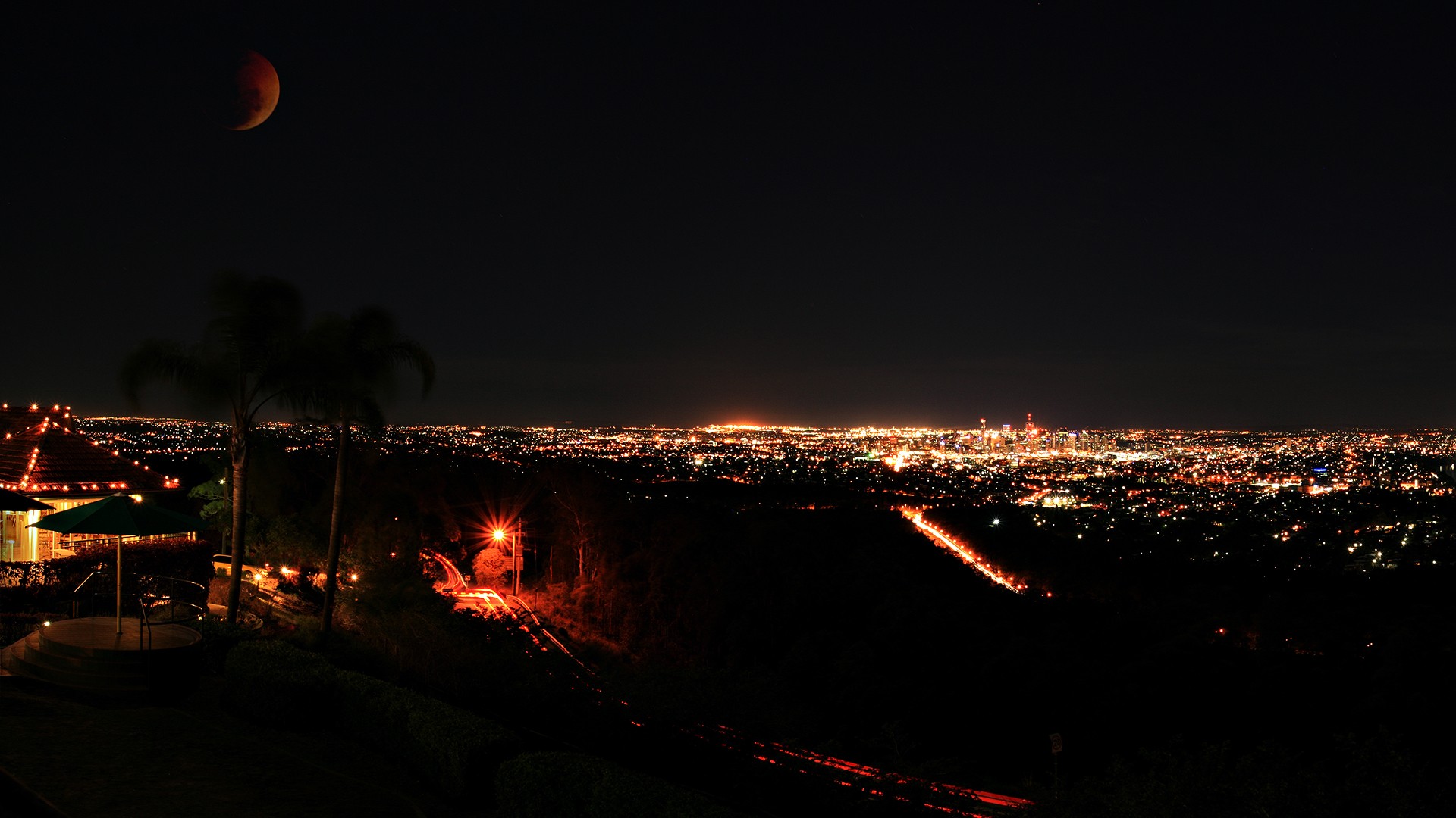 Brisbane cityscape at night with a lunar eclipse HD Wallpaper