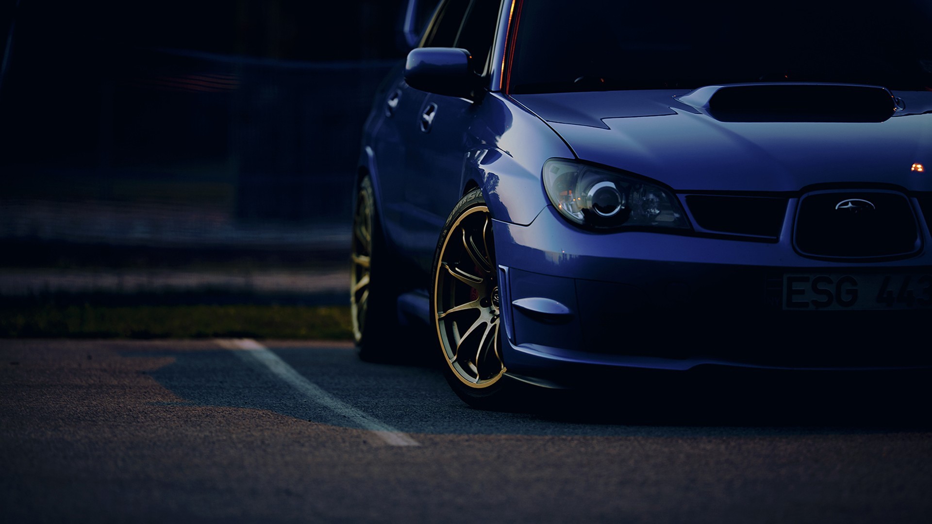 Blue Subaru Impreza STI parked on asphalt HD Wallpaper