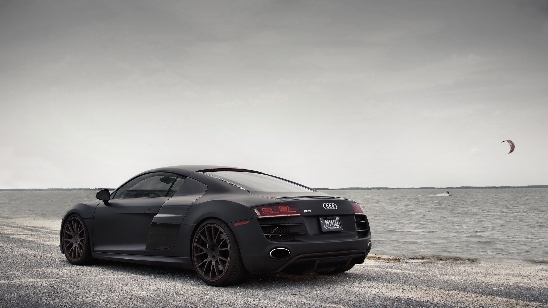 Matte black Audi R8 parked by the water HD Wallpaper