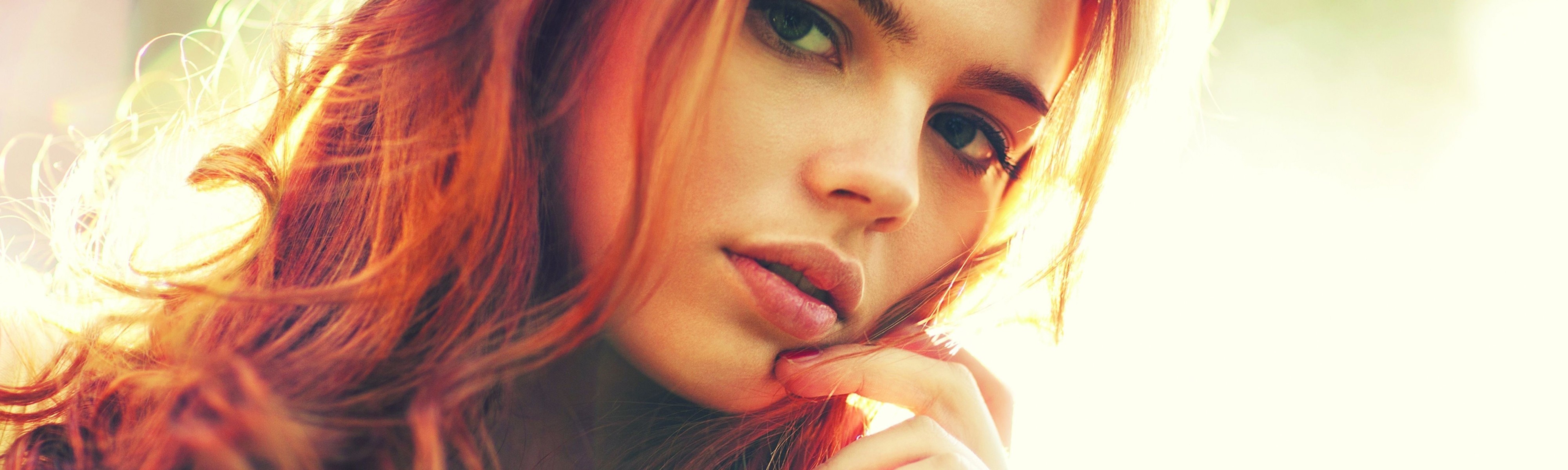 Redhead woman with green eyes in sunlight HD Wallpaper