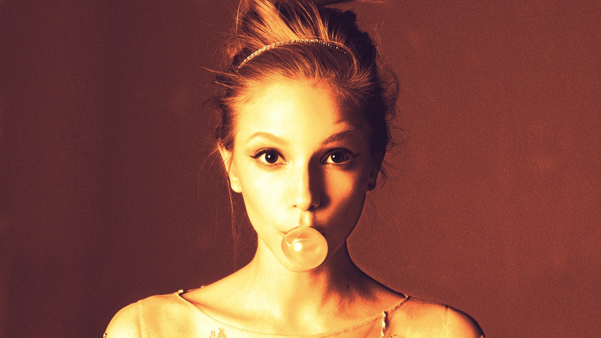 Woman blowing a bubblegum bubble HD Wallpaper