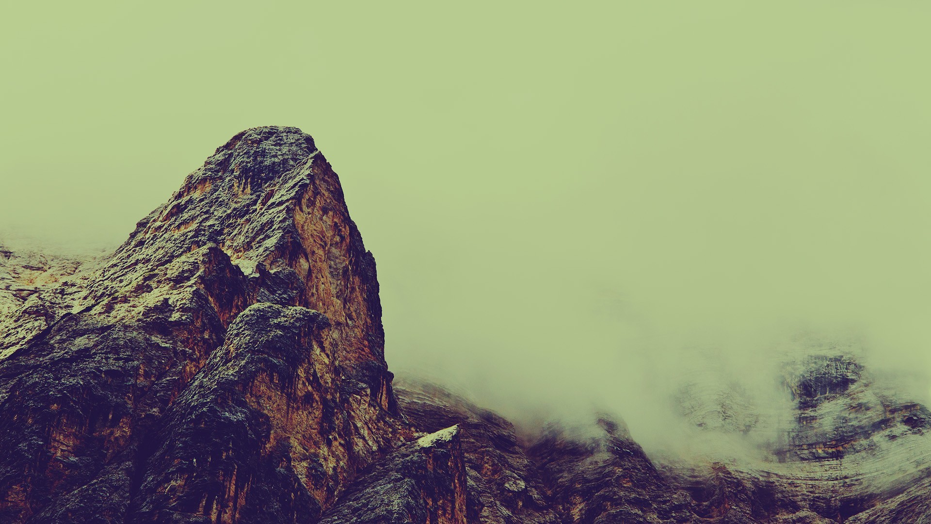 Misty mountains under a pale sky HD Wallpaper