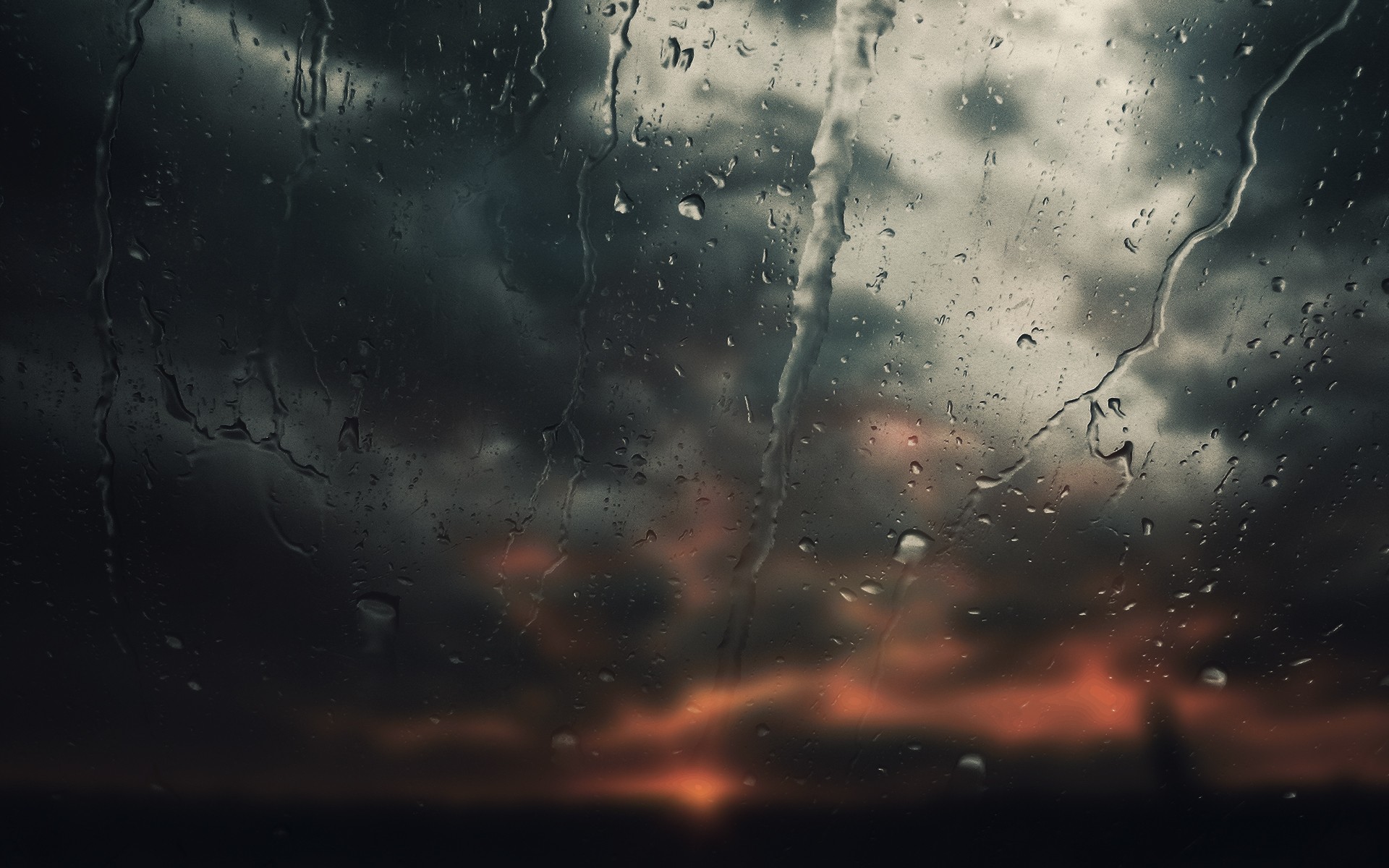 Water drops on glass with stormy sunset HD Wallpaper