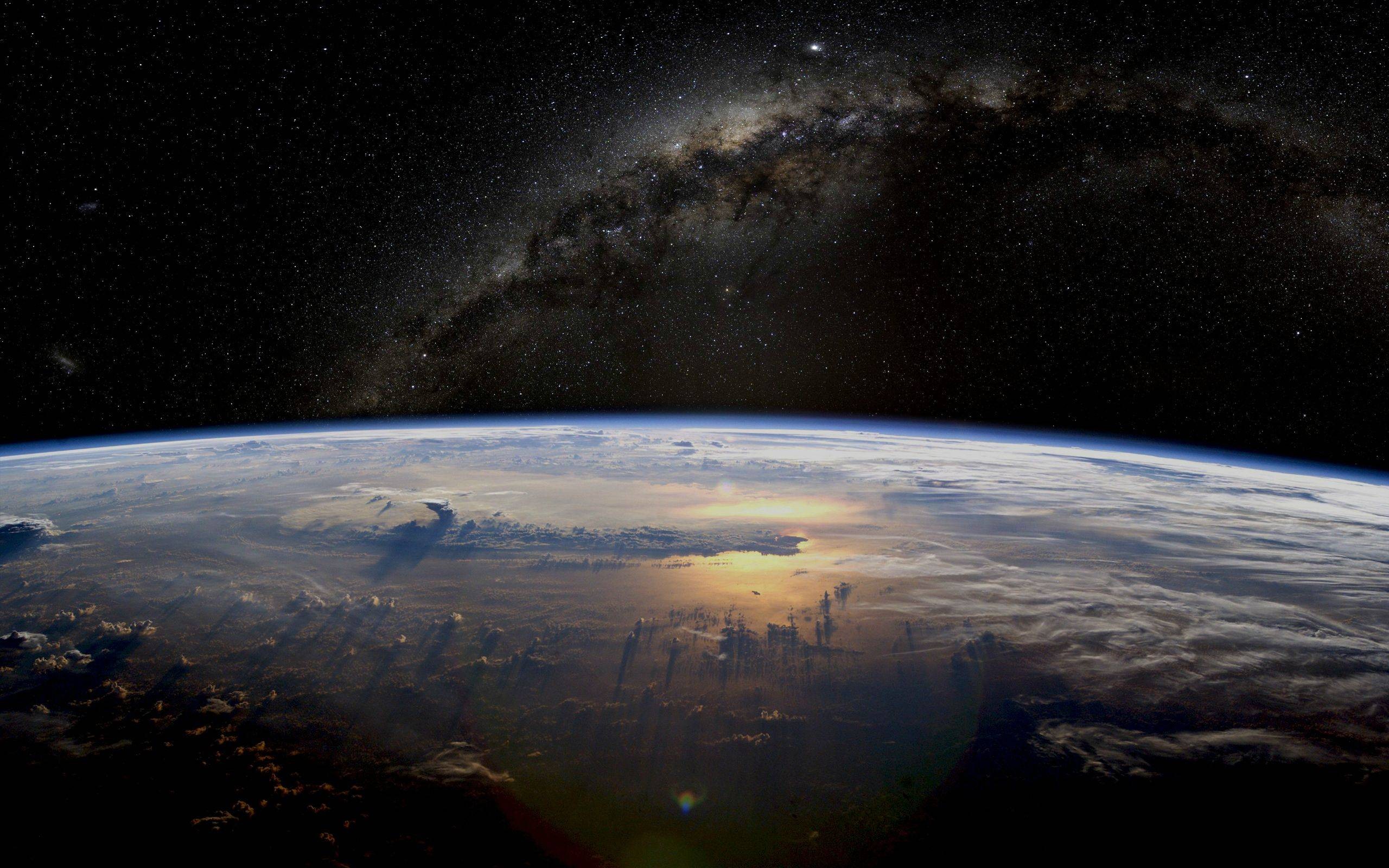 Earth and the Milky Way galaxy from space HD Wallpaper