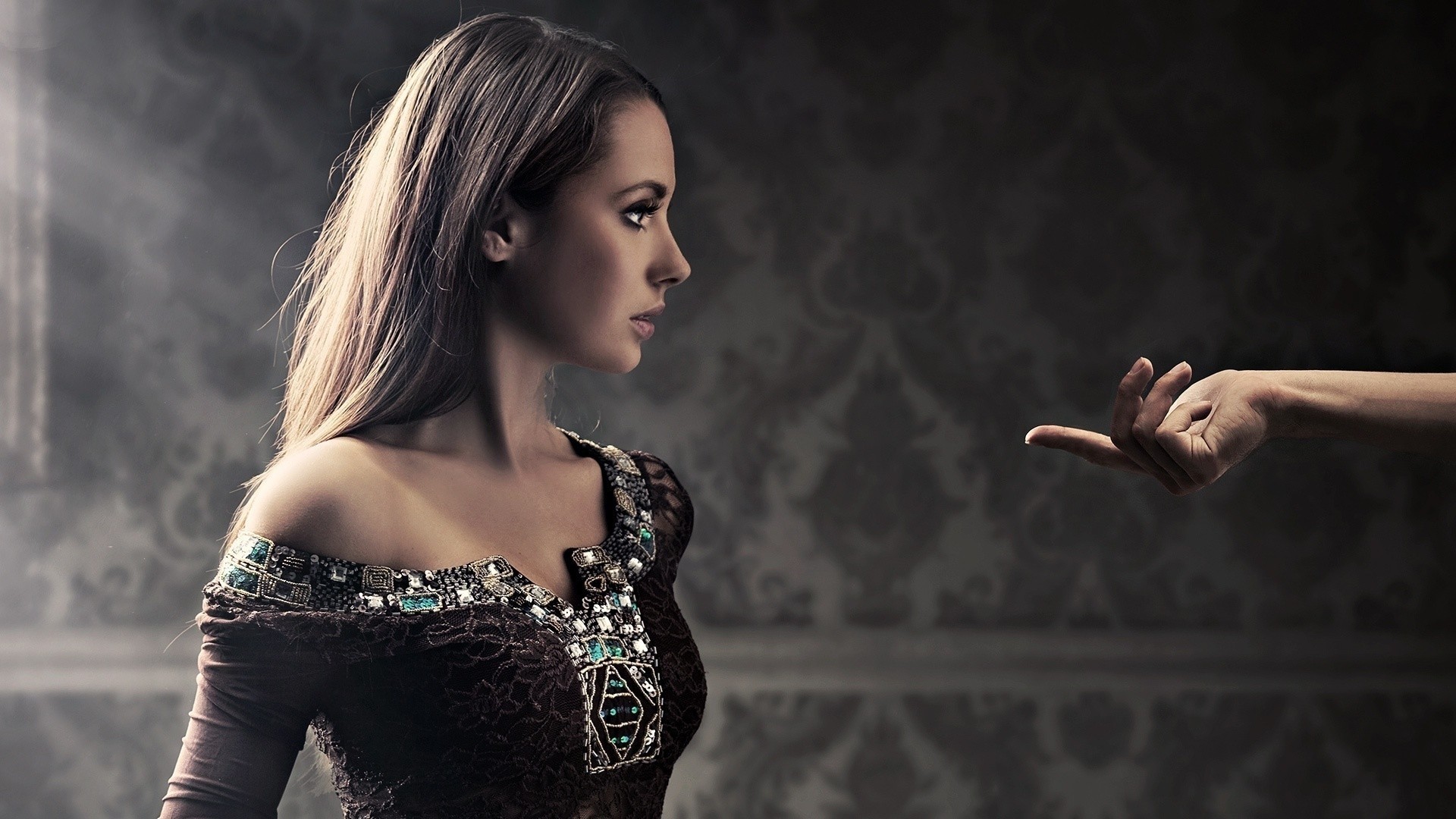 Woman in ornate dress with hand reaching out HD Wallpaper