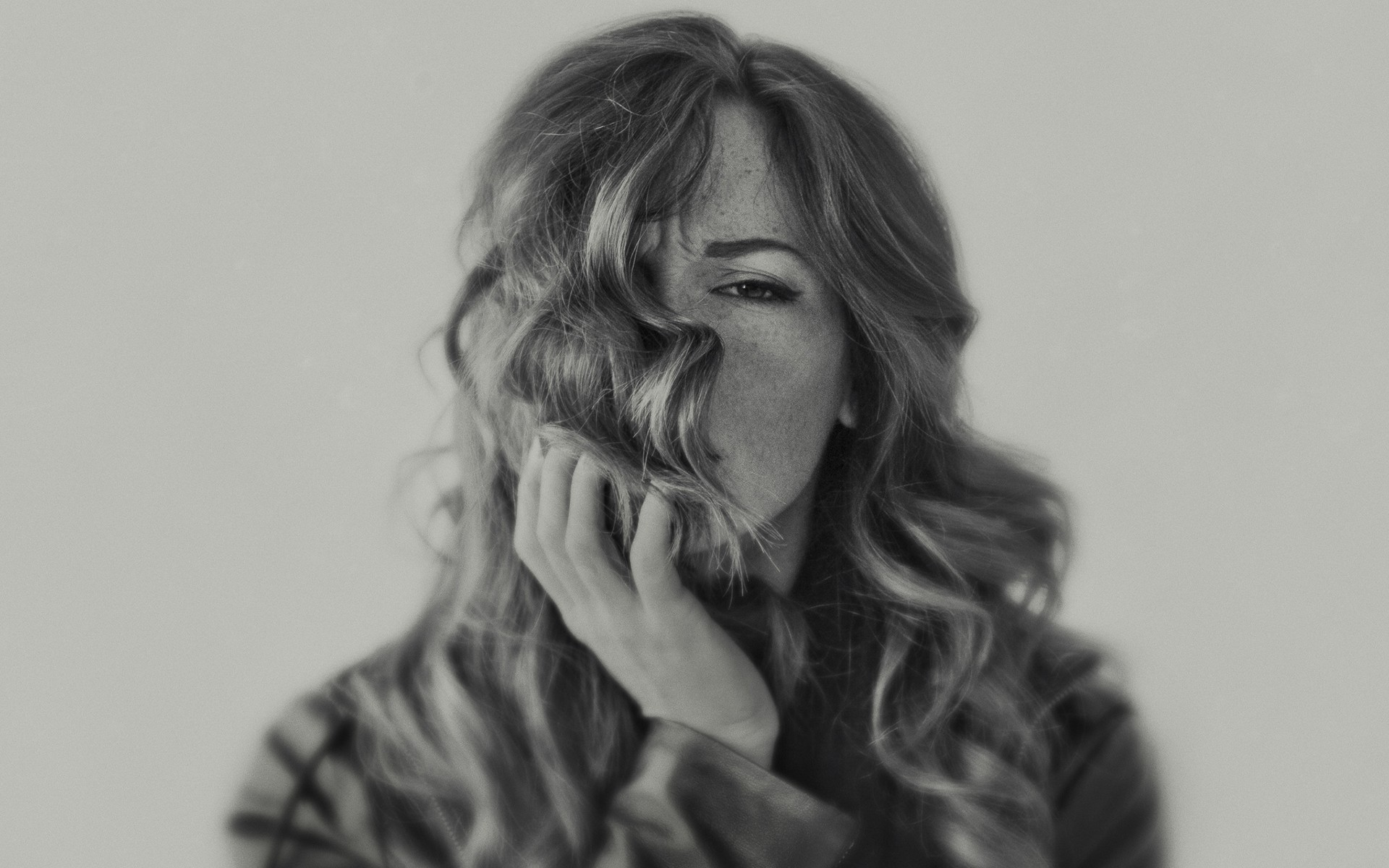 Woman with freckles and wavy hair in monochrome HD Wallpaper