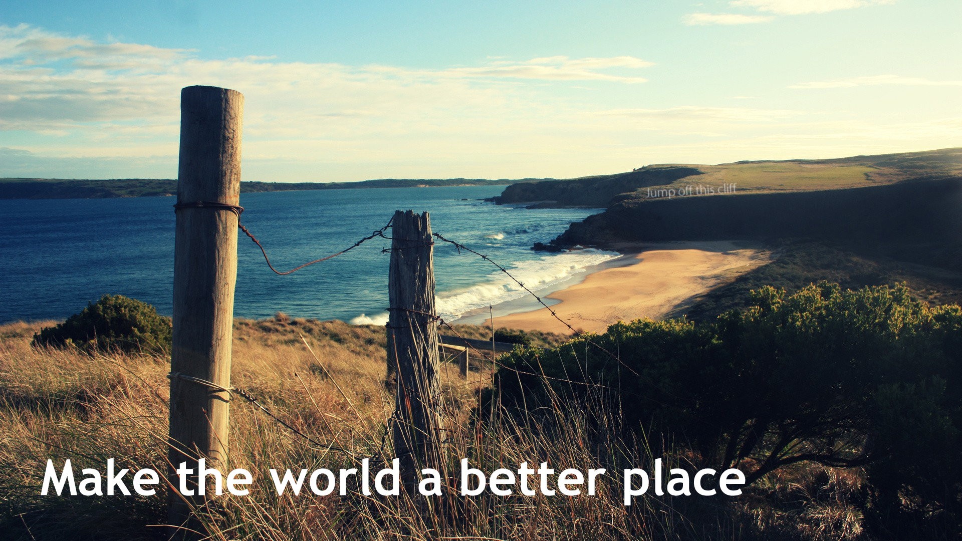 Make the world a better place quote on a cliffside HD Wallpaper